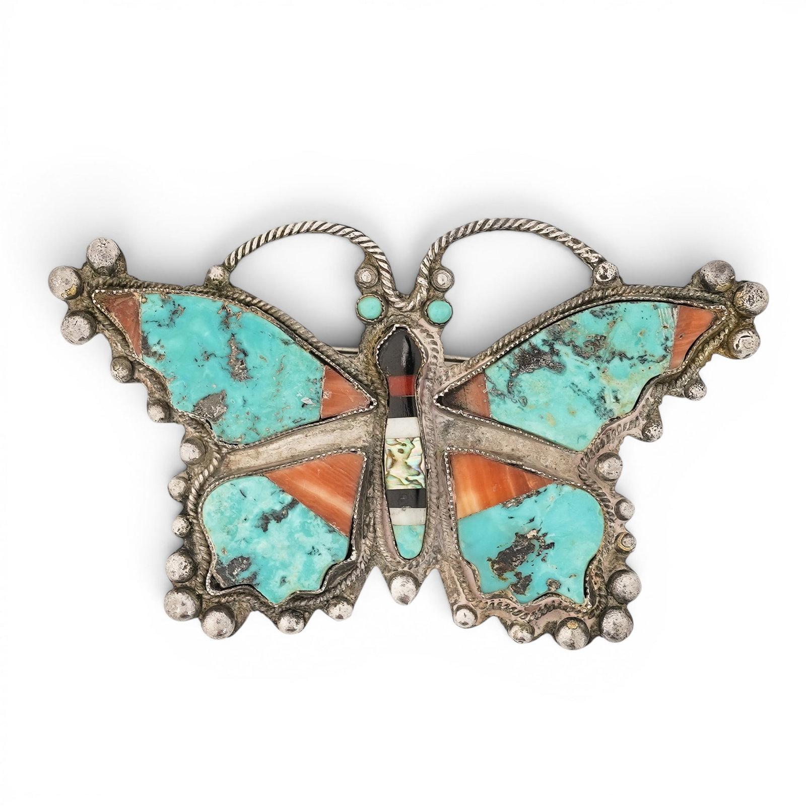 Vintage Zuni Sterling Silver Butterfly Inlay Brooch: Vintage Zuni Sterling Silver Butterfly Inlay Brooch 1970s-1980s, USA Large Zuni sterling silver butterfly form brooch with turquoise, coral, jet, and mother-of-pearl stone inlay throughout the wings