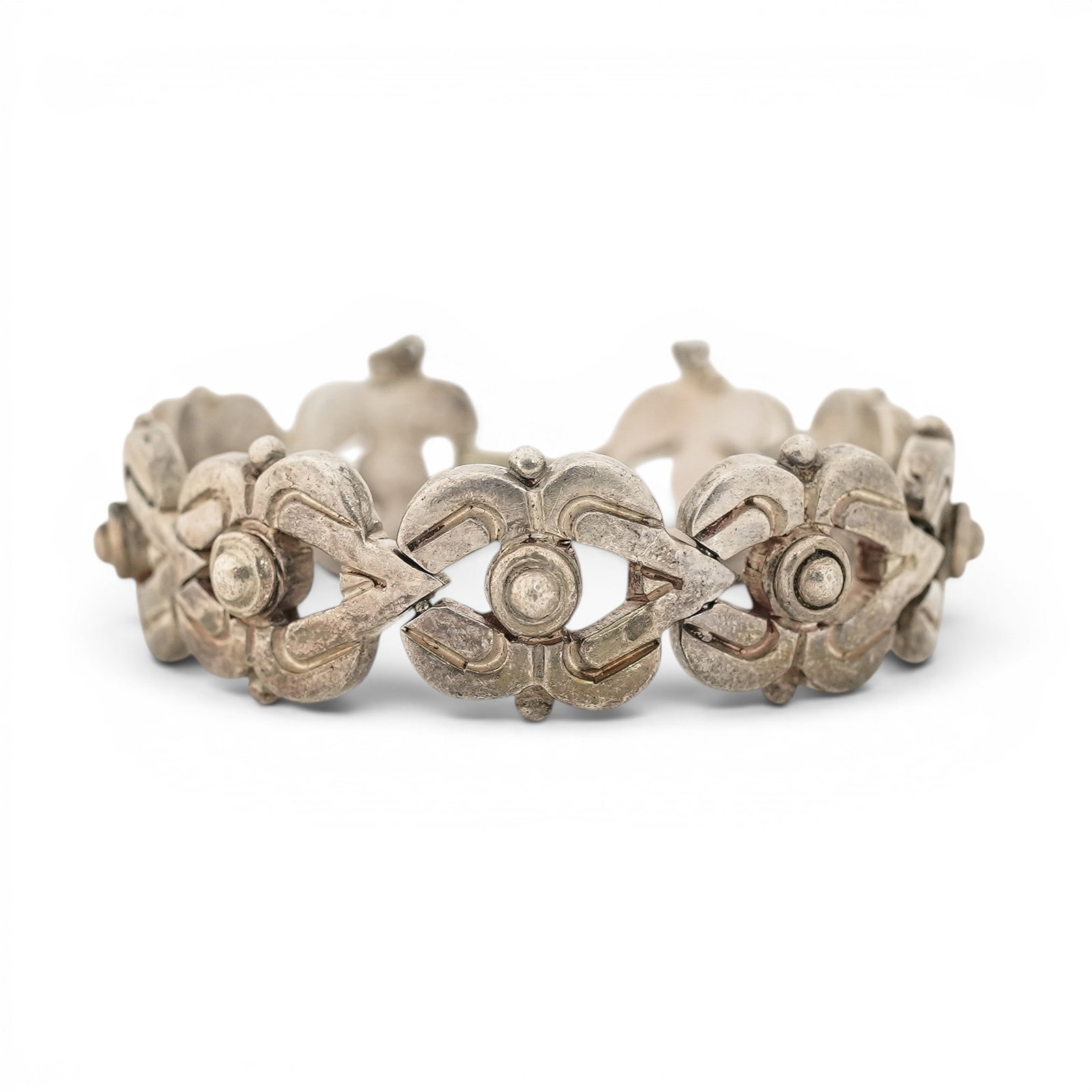 Mexican Sterling Silver Floral Link Bracelet Signed: Mexican Sterling Silver Floral Link Bracelet Signed Mid 20th century, Mexico Mexican sterling silver bracelet with articulated floral-form links, raised central bosses, pierced openwork details, and