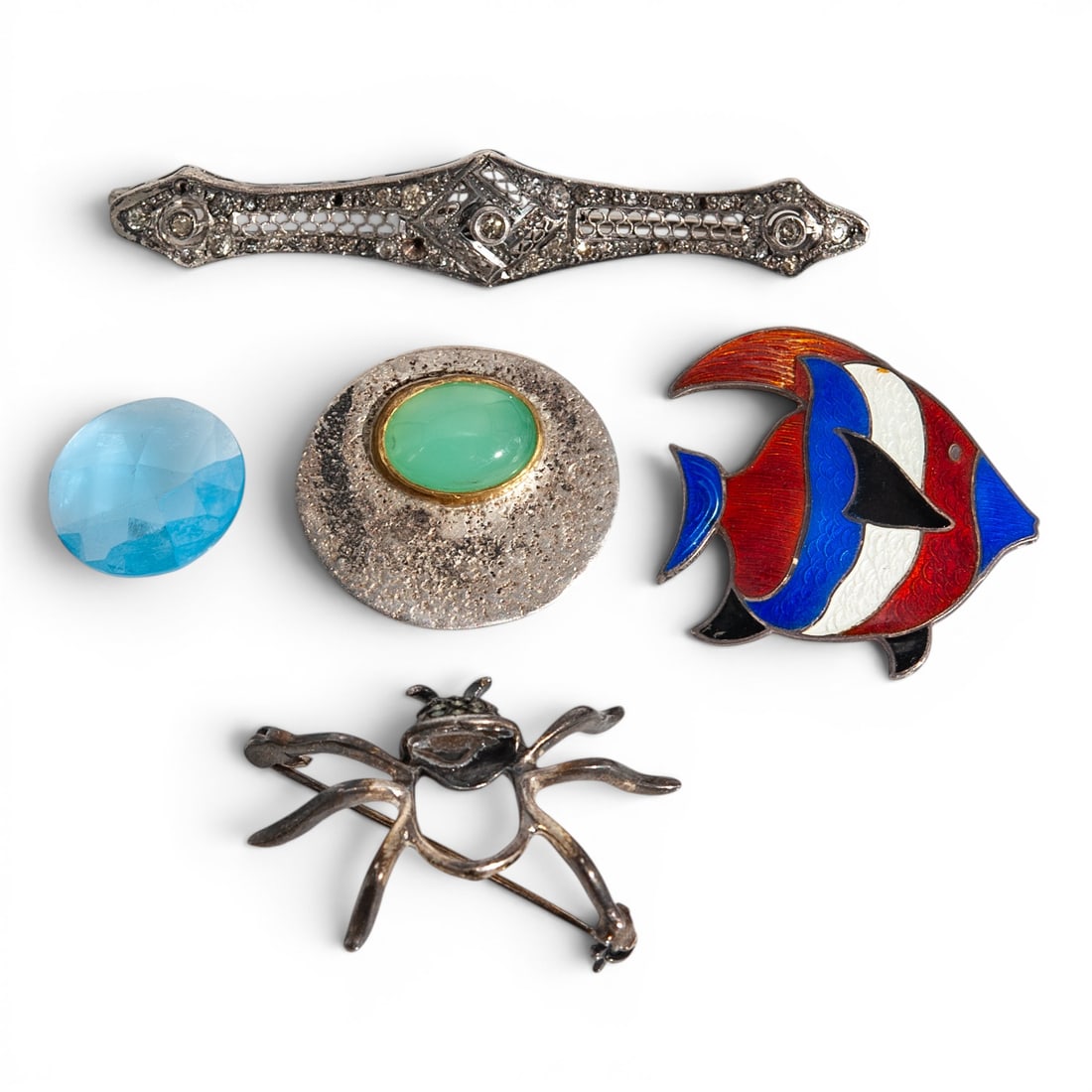 Sterling Silver Mixed Brooch Group: Sterling Silver Mixed Brooch Group 1950s-1980s Group of four sterling silver brooches including an Art Deco style marcasite bar brooch, modernist oval cabochon brooch signed “STERLING HK BV,” 