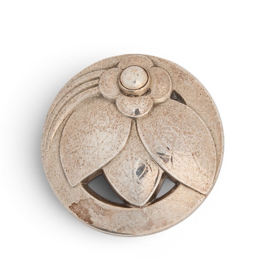 Georg Jensen Sterling Silver Floral Brooch No. 127: Georg Jensen Sterling Silver Floral Brooch No. 127 1940s-1950s, Danish Art Nouveau-inspired circular brooch in sterling silver with layered floral and foliate motif in openwork form, engraved leaf