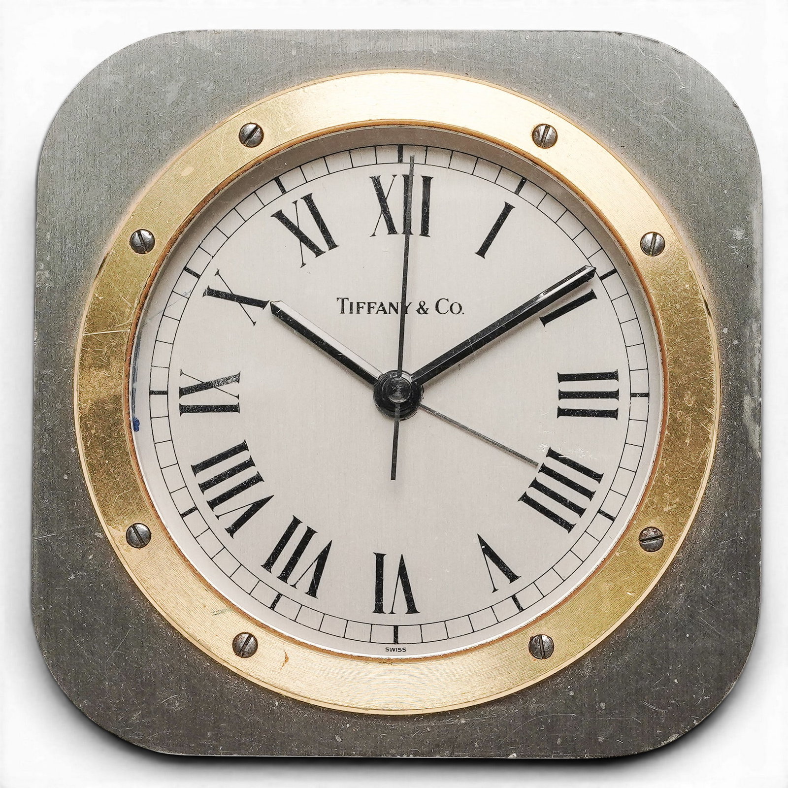 Tiffany & Co. Square Desk Alarm Clock: Tiffany & Co. Square Desk Alarm Clock 20th century, Swiss A heavy two-tone design featuring a brushed stainless steel square frame, rounded corners with polished gold-tone brass circular bezel