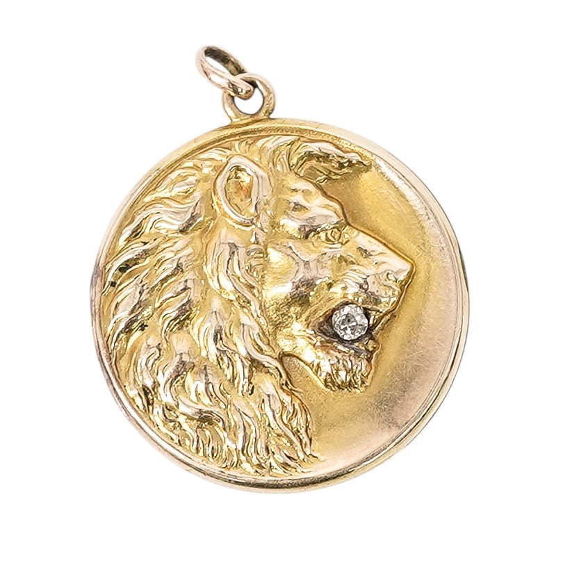 Antique SKM & Co. 10k Gold & Diamond Lion Locket Pendant: Antique SKM & Co. 10k Gold & Diamond Lion Locket Pendant 1900s, USA Antique 10k yellow gold round hinged locket pendant featuring a raised lion head motif holding a round diamond, approx. 0.20 ctw.