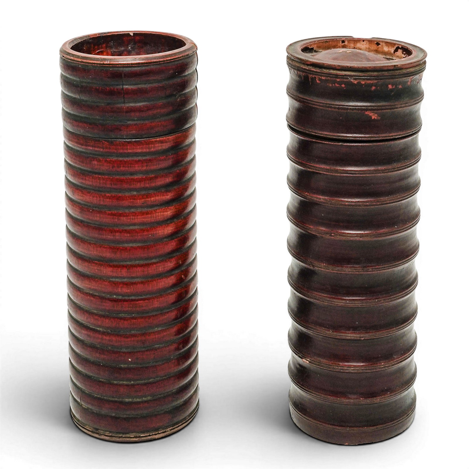 (2 pc) Antique Chinese Lacquered Wood Cylindrical Boxes: (2 pc) Antique Chinese Lacquered Wood Cylindrical Boxes 20th Century, China Pair of Chinese cylindrical wood boxes with ribbed exterior decoration and deep red-brown lacquer finish. Interiors, lids,