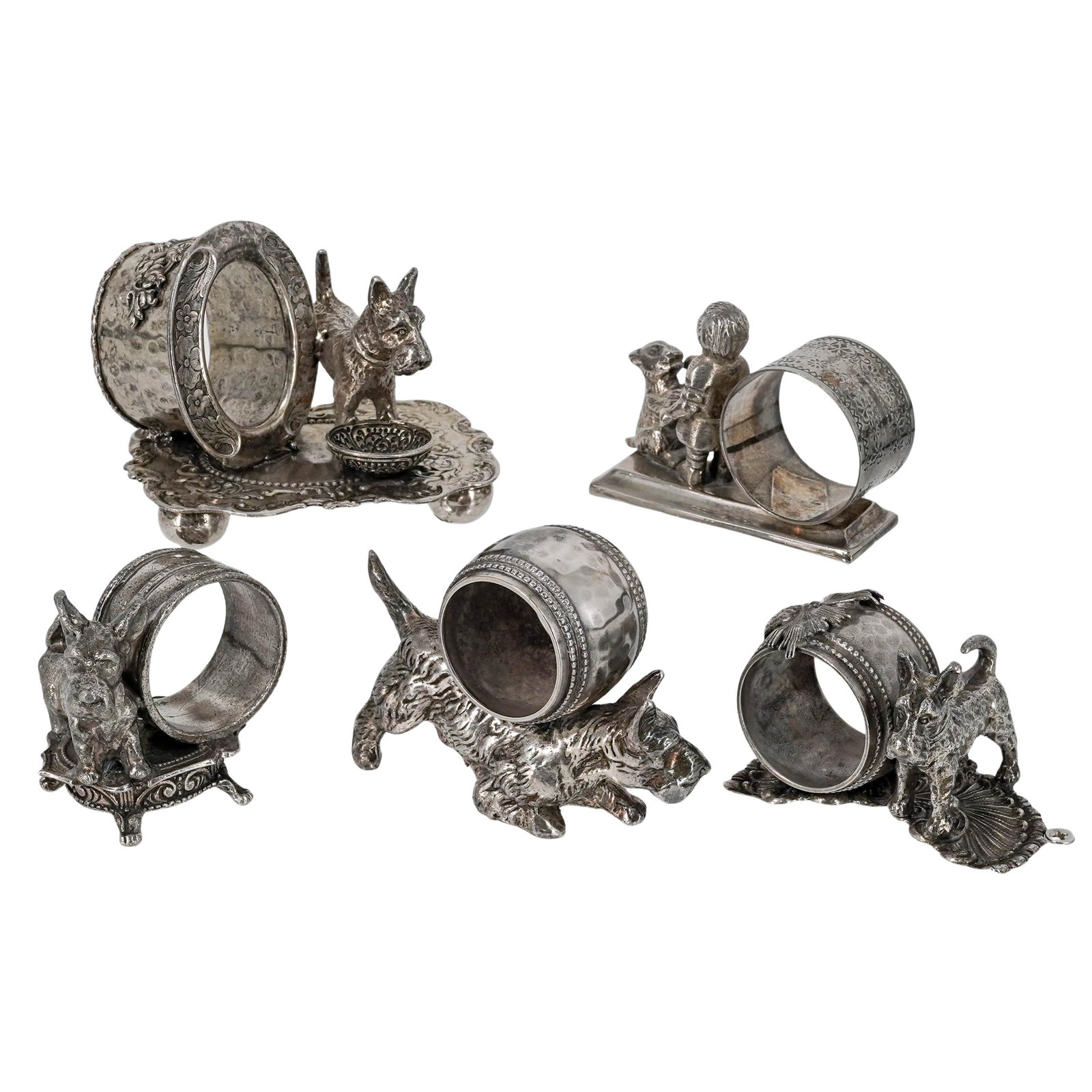(5pc) Victorian Silver-Plated Figural Napkin Rings: (5pc) Victorian Silver-Plated Figural Napkin Rings Late 19th to early 20th Cent. The collection features highly detailed figural supports, including several Scottish Terriers (Scotties), a seated