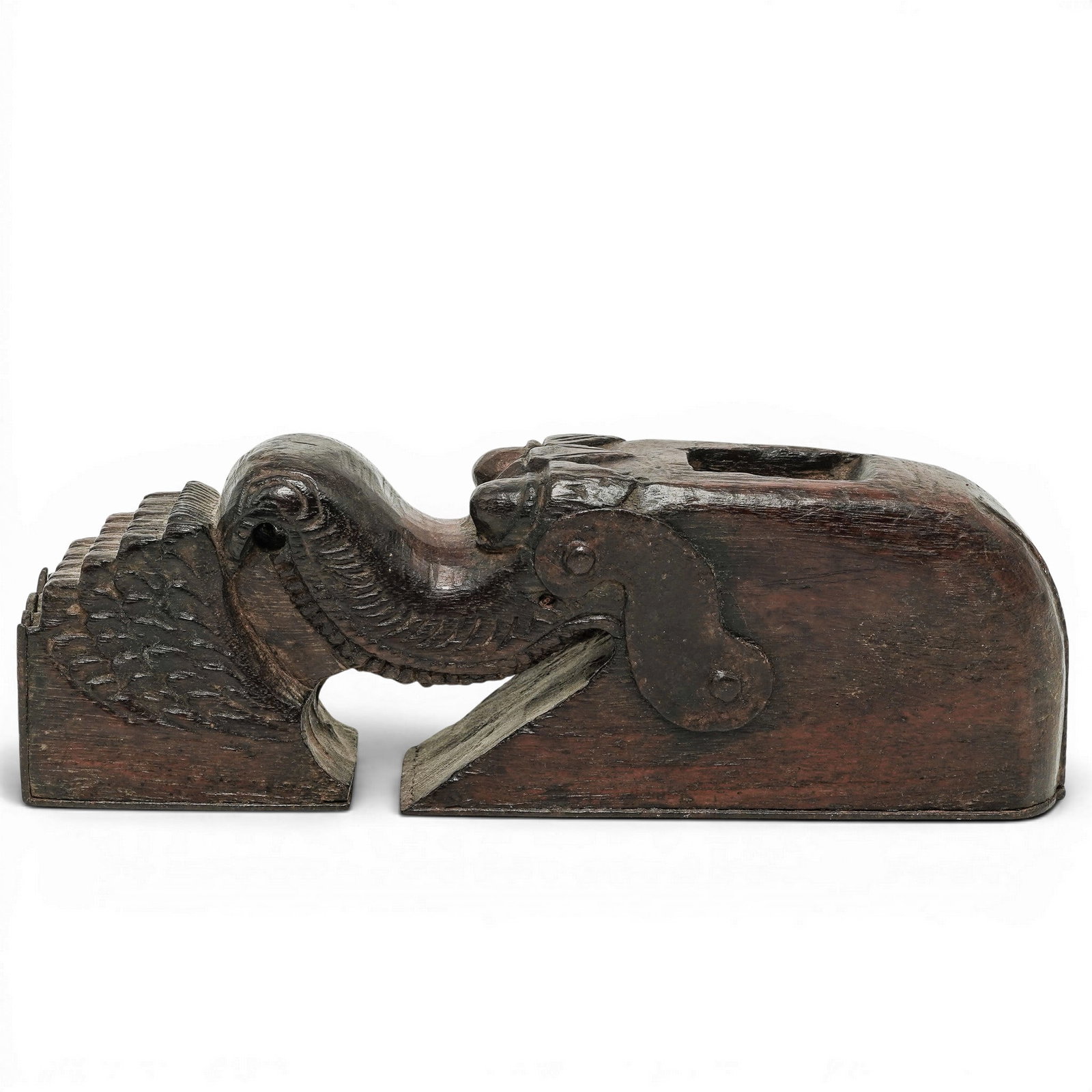 Antique Carved Wood Mythological Bracket: Antique Carved Wood Mythological Bracket Late 19th - 20th Century, East Asia Antique carved wooden architectural bracket depicting a stylized mythological dragon with prominent eyes, elongated snout,