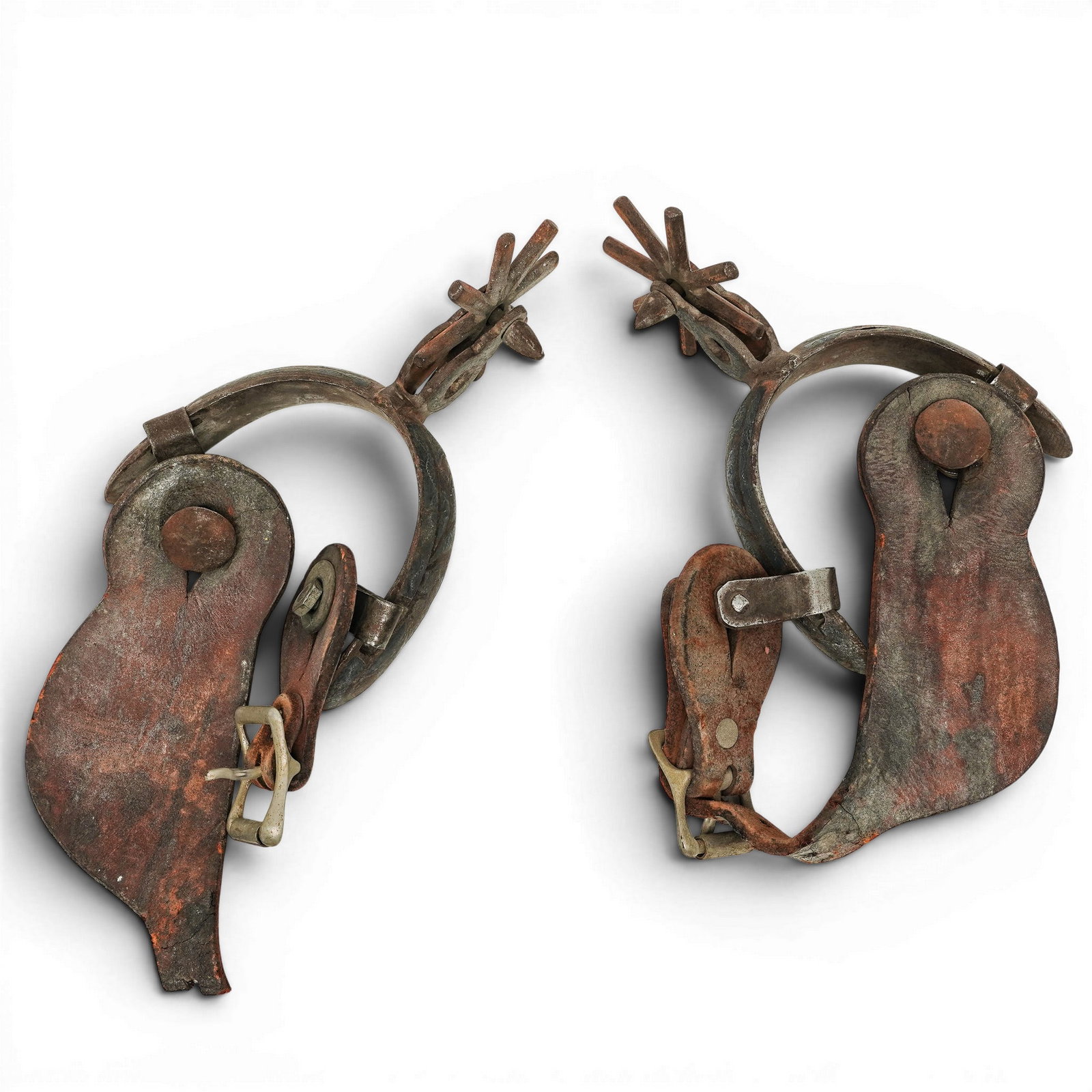 (2 Pc) Antique Western Iron and Leather Rodeo Spurs: (2 Pc) Antique Western Iron and Leather Rodeo Spurs Early 20th Century, United States of America A rugged pair of 20th-century Western rodeo spurs crafted in iron and fitted with leather straps.