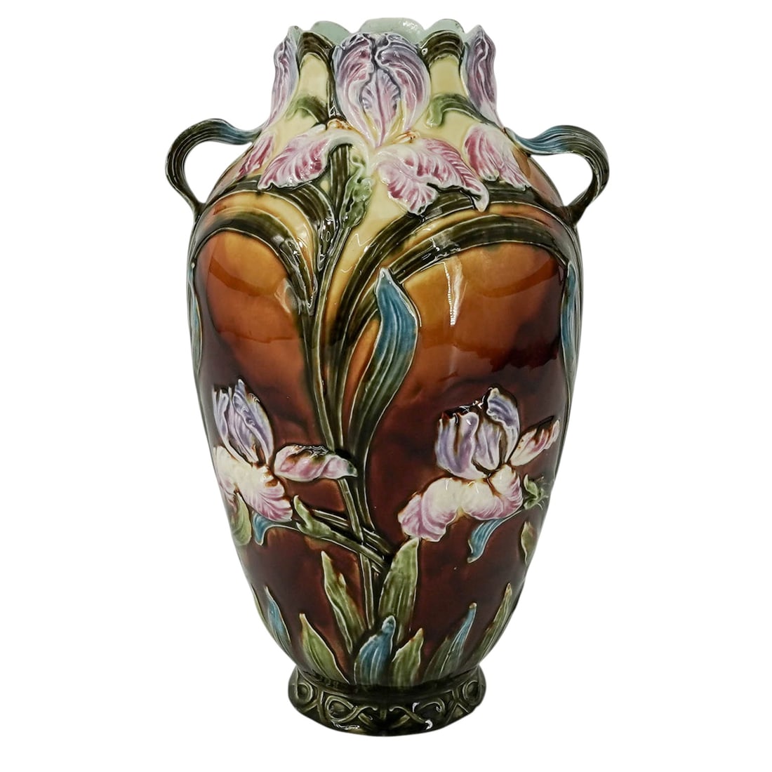 Art Nouveau Bohemian Majolica Vase: Art Nouveau Bohemian Majolica Vase Early 20th Cent. Austrian This antique Art Nouveau Bohemian majolica vase features high-relief purple and pink irises over a glossy caramel-brown and olive-green