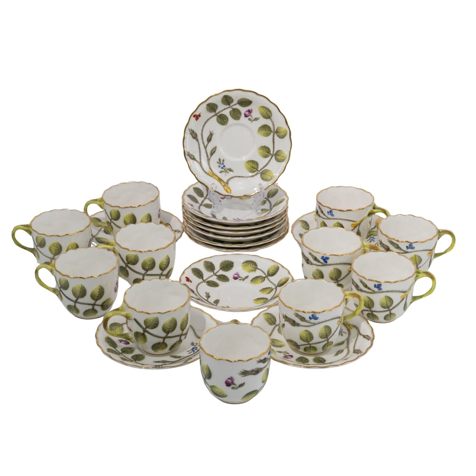 (23 pc) Royal Worcester Raised ‘Blind Earl’ Porcelain Tea Set: 23-piece Royal Worcester porcelain tea set in the desirable Raised “Blind Earl” pattern, decorated with hand-painted green leaves, floral sprigs, and gilt trim. The set features scalloped rims
