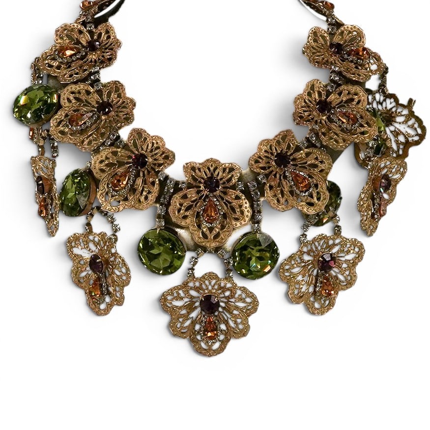 Vintage Mimi di Niscemi Floral Necklace: Vintage Mimi di Niscemi Floral Necklace 1960s-1970s, American A Mimi di Niscemi gilt tonw floral necklace with large green stone pendants and purple, clear stone, and orange stone embellishments.