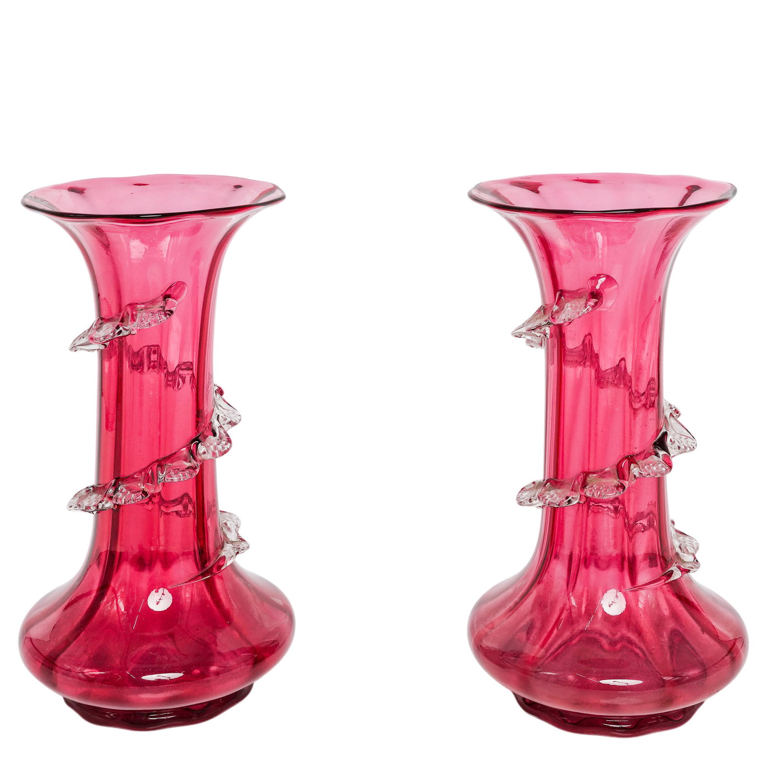 Pair Antique Victorian Cranberry Glass Ribboned Vases: Pair Antique Victorian Cranberry Glass Ribboned Vases c. 1880-1910. European Pair Victorian cranberry glass vases featuring distinctive applied clear glass decorations. Each vase is shaped in a