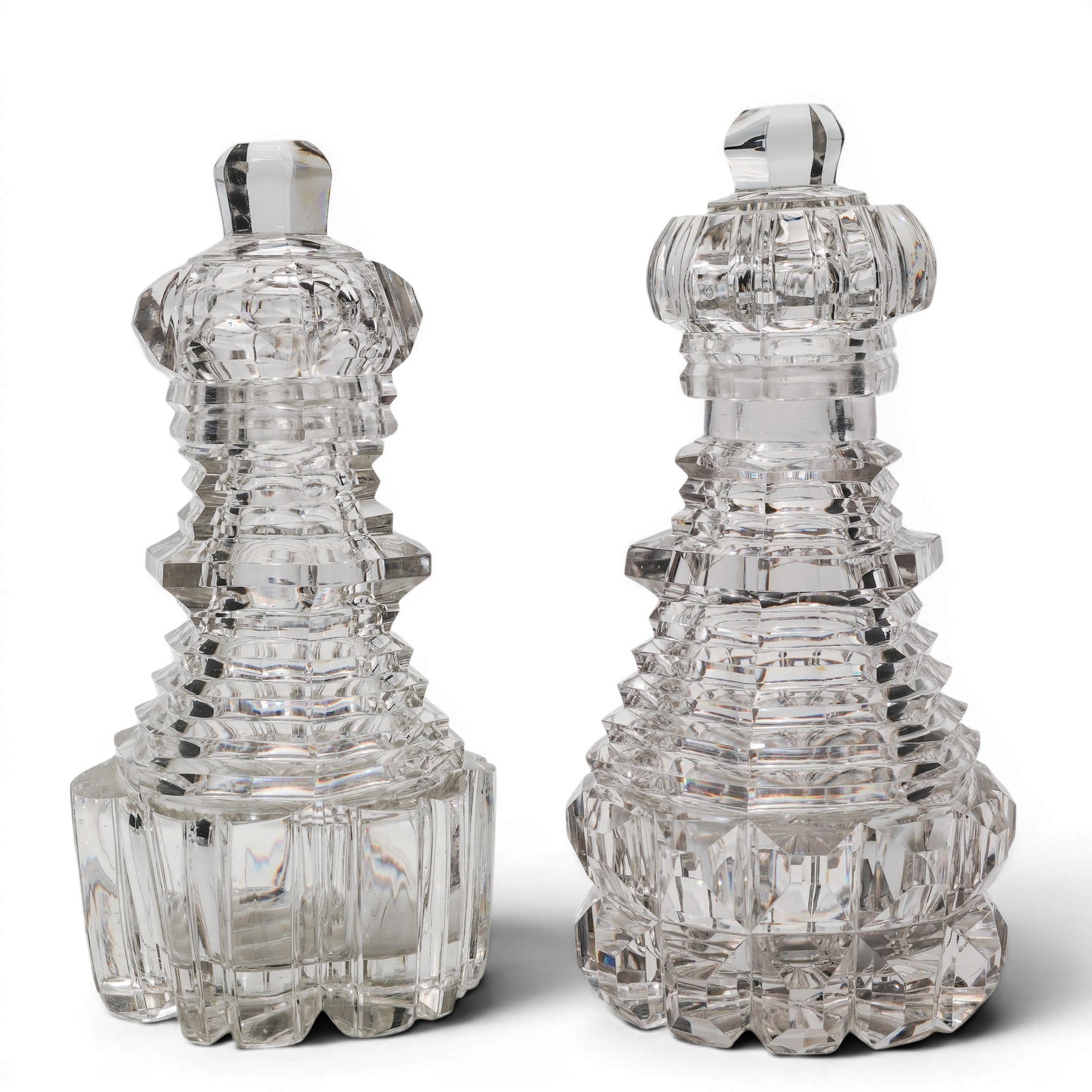 Pair of Antique Cut Glass Decanters: Pair of Antique Cut Glass Decanters Early 20th century, USA Pair cut glass decanters with a faceted stopper and a body with geometric cuts. #AKH H 7.25" x W 4"