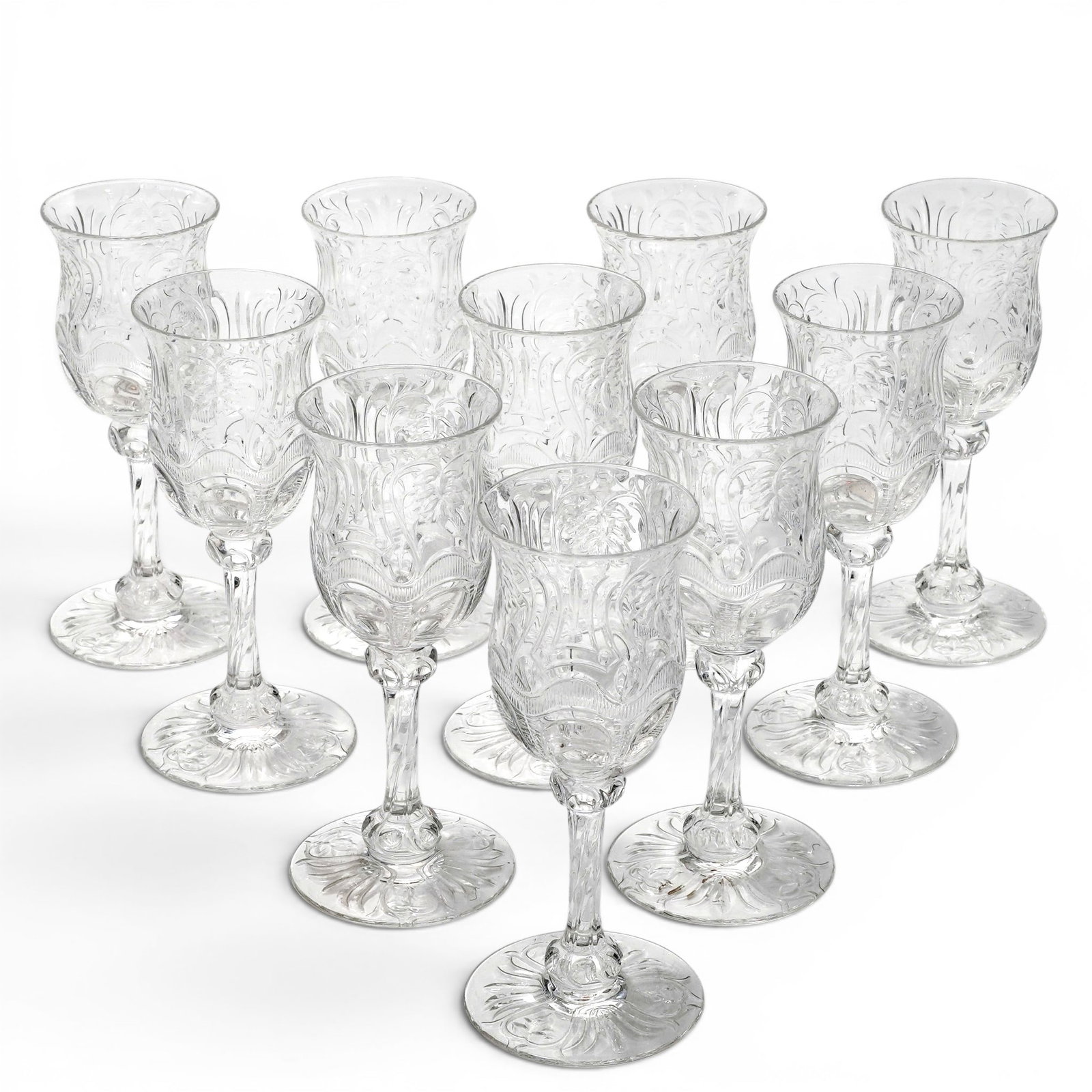 (11 pc) Antique Intaglio Cut Glasses: (11 pc) Antique Intaglio Cut Glasses c. 1920s-1930s. USA This type of intricate pressed glassware with floral motifs was incredibly popular throughout the Early American Pattern Glass era and saw