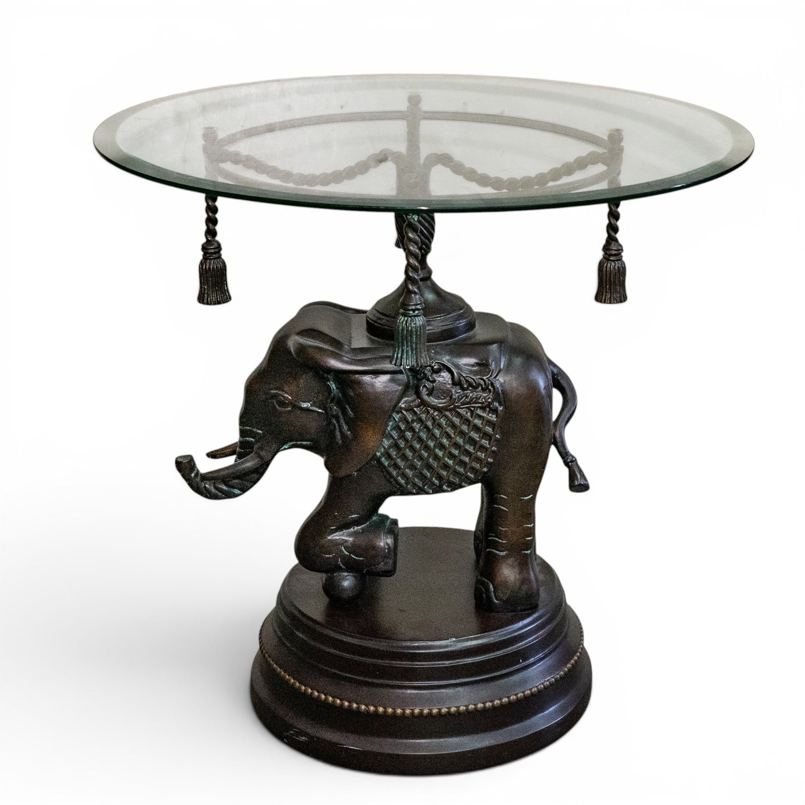 Contemporary Elephant Form Resin and Glass Table: Contemporary Elephant Form Resin and Glass Table 21st Cent. Continental Contemporary side table featuring a sculptural elephant-form base in dark finished resin, supporting a circular glass top. The b