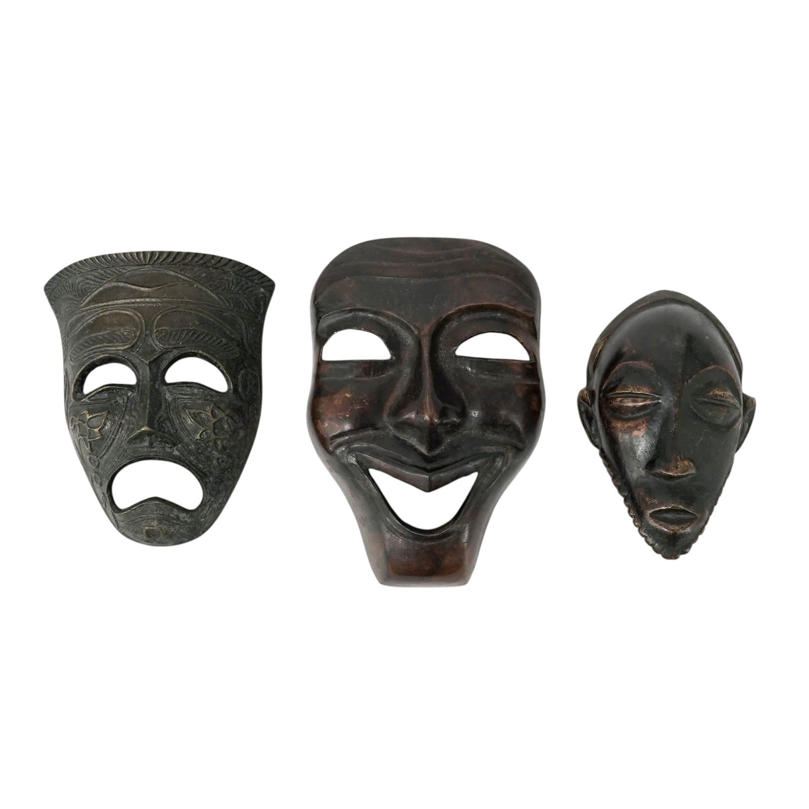 (3 pc) Senegal Bronze Wall Hanging Face Masks: (3 pc) Senegal Bronze Wall Hanging Face Masks 20th century, Senegal Lot of Senegal bronze face masks includes: (1) Tragedy Mask, oval and deeply cupped, with a build in metal loop is integrated into