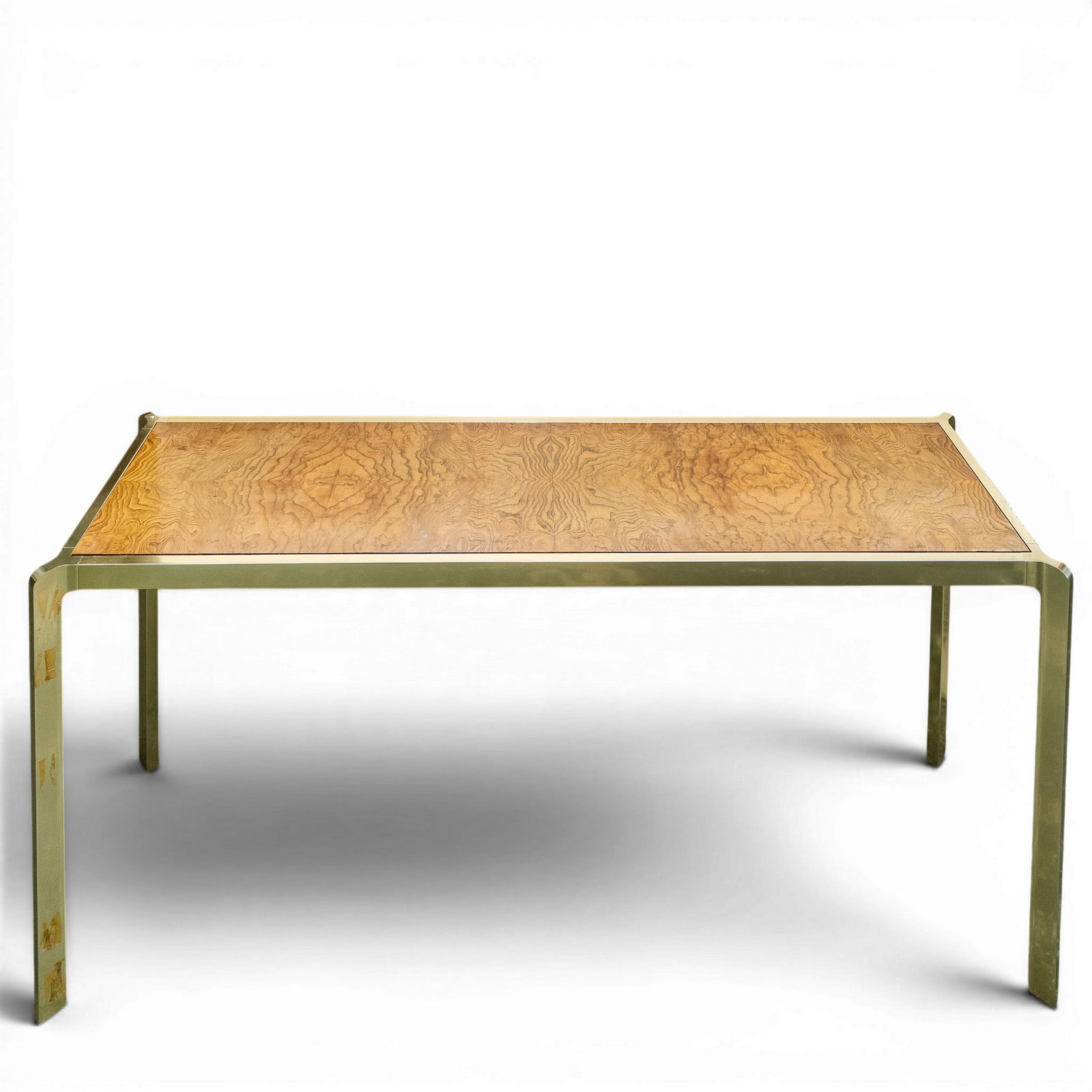 Mid-Century Brass & Burl-Wood Console Table: Mid-Century Brass & Burl-Wood Console Table Mid-20th Century, Continental. Console table crafted from a brass frame foundation, inserted with a burl-wood table top. H: 26" x W: 59" x D: 17.5"