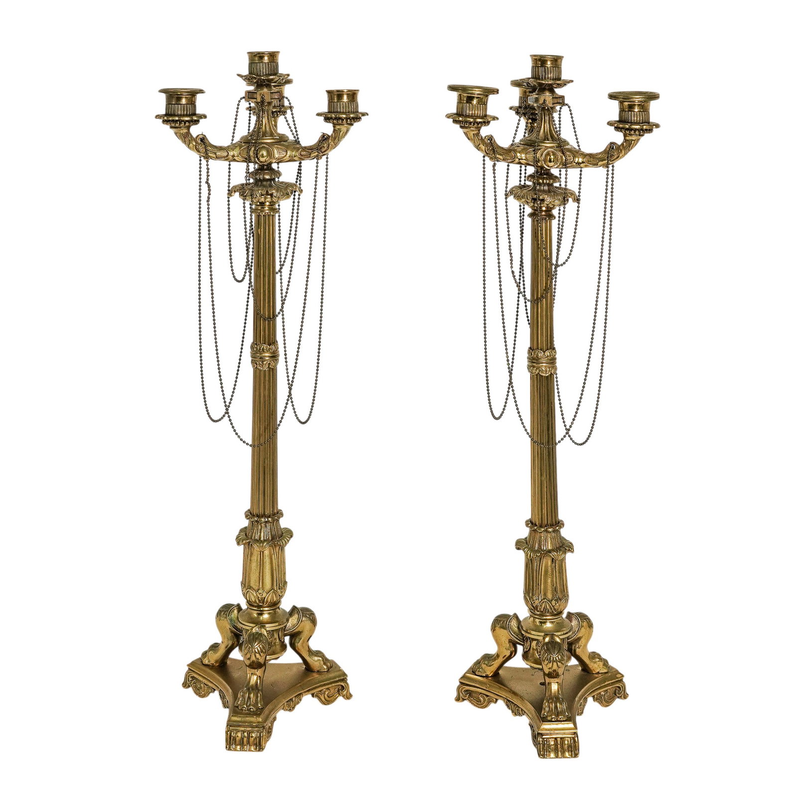 Pair Of Antique French Gilt Bronze Candelabras: Pair Of Antique French Gilt Bronze Candelabras 19th Cent., French A pair of 19th-century Napoleon III Neo-Grec candelabra in gilt bronze. Each piece features a fluted column rising from a classical tr