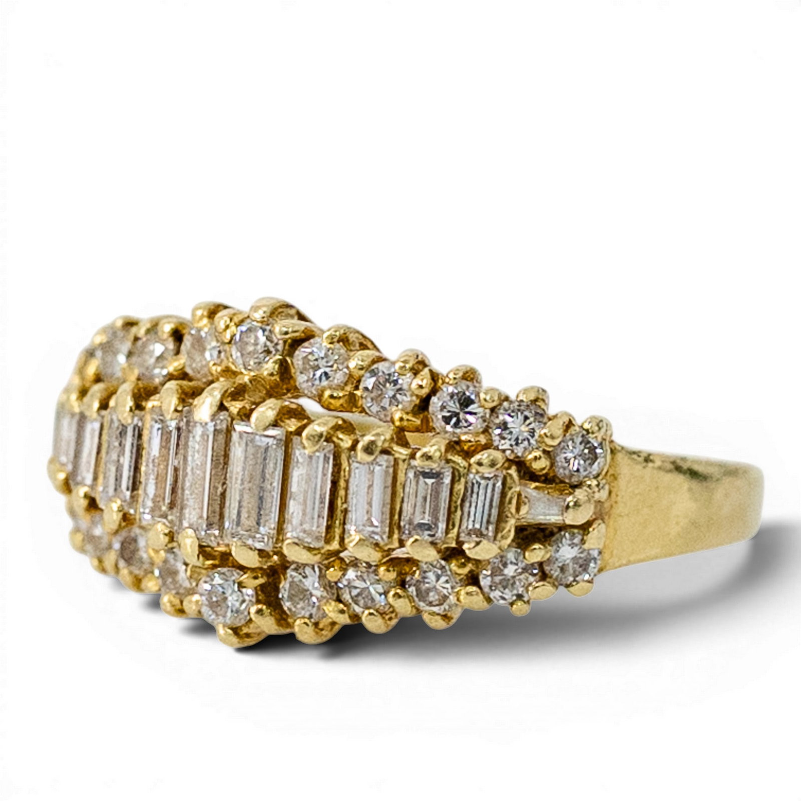 18k Gold & Diamond Baguette Cluster Ring: 18k Gold & Diamond Baguette Cluster Ring Late 20th Century 18k yellow gold wide cluster ring featuring a center row of rectangular baguette-cut diamonds bordered by rows of round brilliant-cut diamond