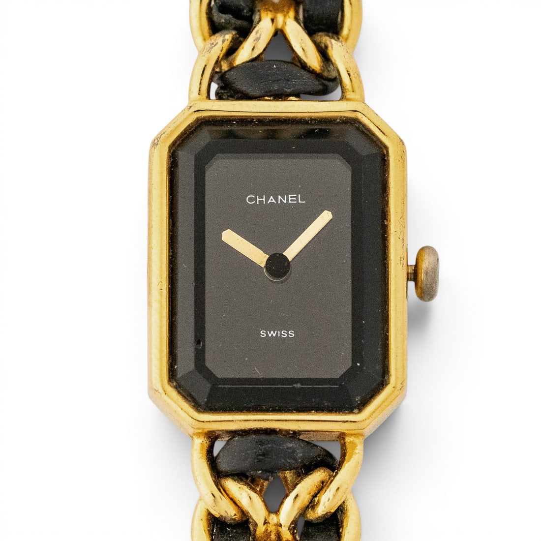 Vintage Chanel Premiere Gold Tone Leather Chain Watch: Vintage Chanel Premiere Gold Tone Leather Chain Watch 1980s - 1990s, Swiss Vintage Chanel Première ladies watch with octagonal gold tone case, black dial, gold tone hands, and interwoven black leathe