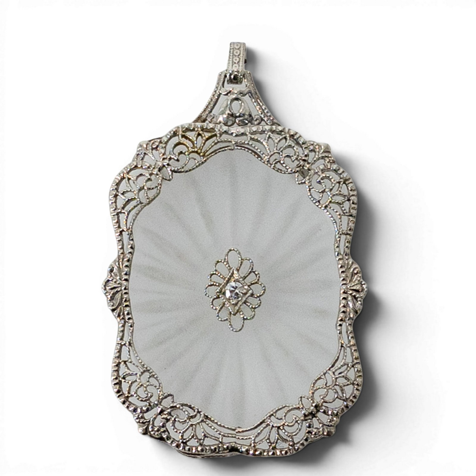 Vintage 14k Gold Rock Crystal & Diamond Pendant: Vintage 14k Gold Rock Crystal & Diamond Pendant 1920s-1930s, USA. Vintage 14k white gold pendant with an oval carved frosted rock crystal plaque in a radiating sunburst design, set within an openwork 