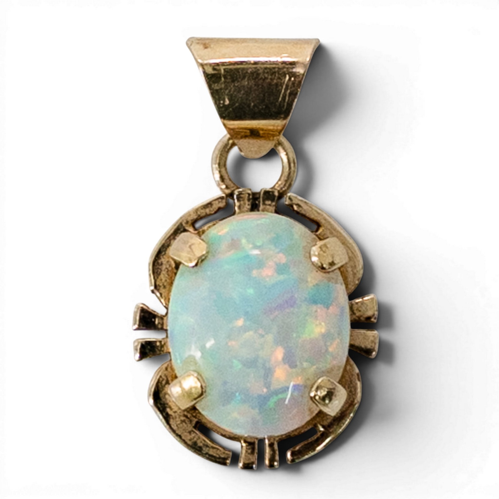 Mark Yazzie 14k Gold & Opal Pendant: Mark Yazzie 14k Gold & Opal Pendant Late 20th Century, USA 14k yellow gold pendant by Mark Yazzie featuring an oval cabochon opal measuring approximately 10 × 8 mm and weighing approximately 1.75 car