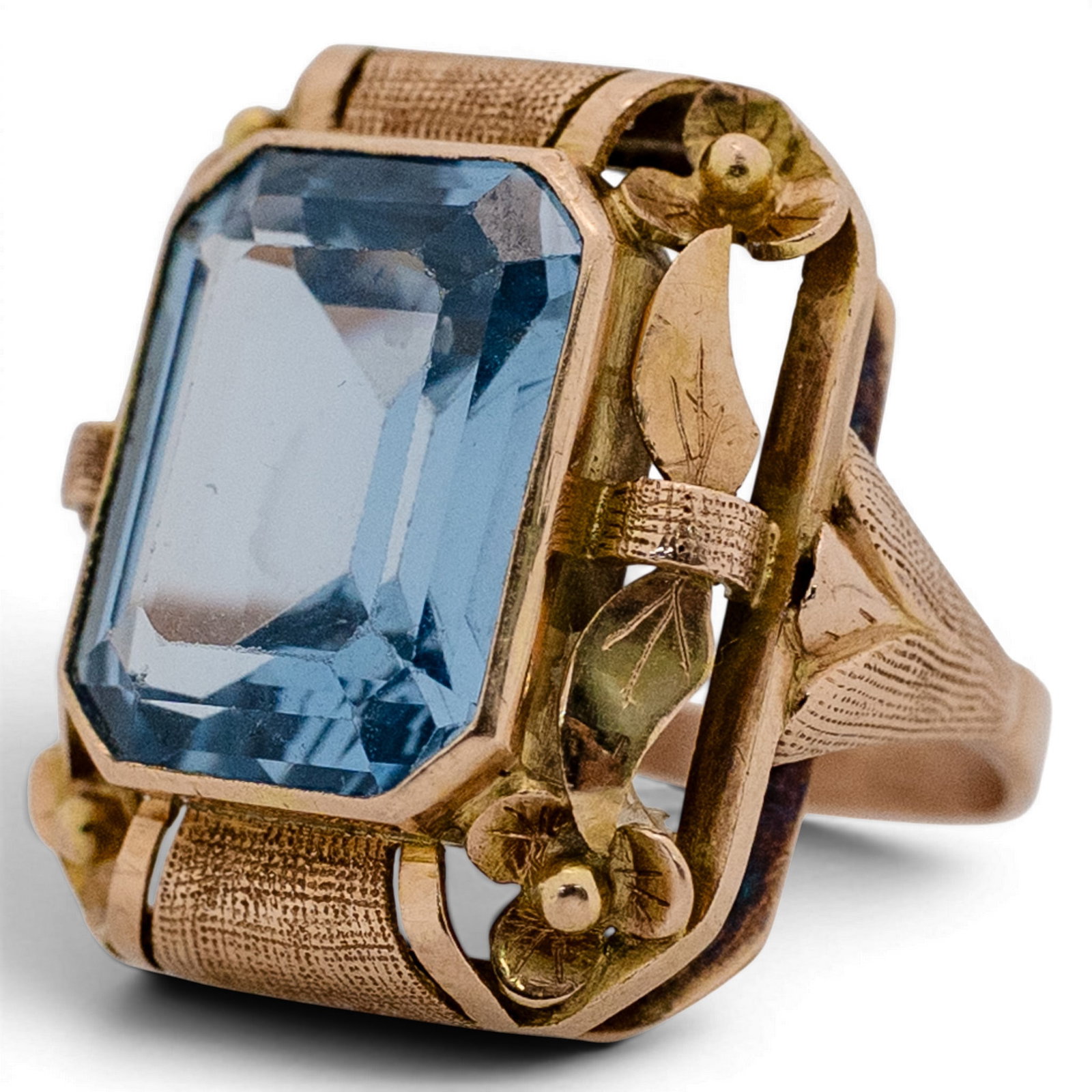 Retro 14k Gold & Blue Topaz Ring: Retro 14k Gold & Blue Topaz Ring 1940s-1950s 14k yellow gold ring featuring a large emerald-cut blue topaz weighing approximately 10.00 carats, set in a raised rectangular frame with textured shoulder