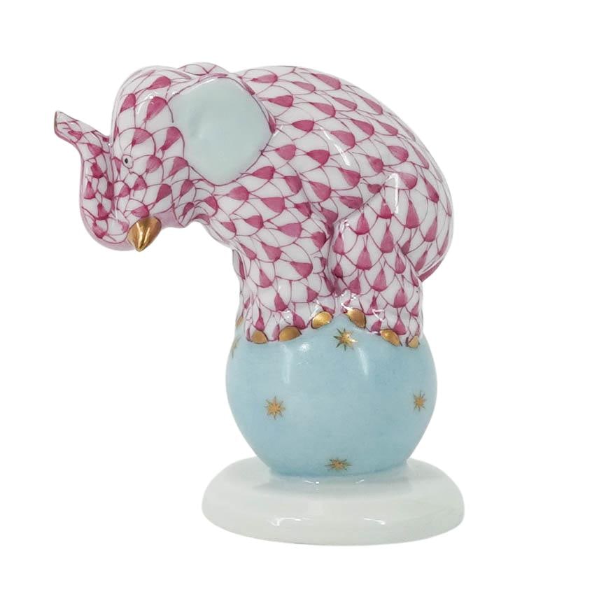 Herend Pink Fishnet Porcelain Elephant on Ball: Herend Pink Fishnet Porcelain Elephant on Ball Early 21st century, Hungarian A miniature Herend porcelain ball on elephant figurine (number 5215) in the pink fishnet color way. Marked on bottom with H