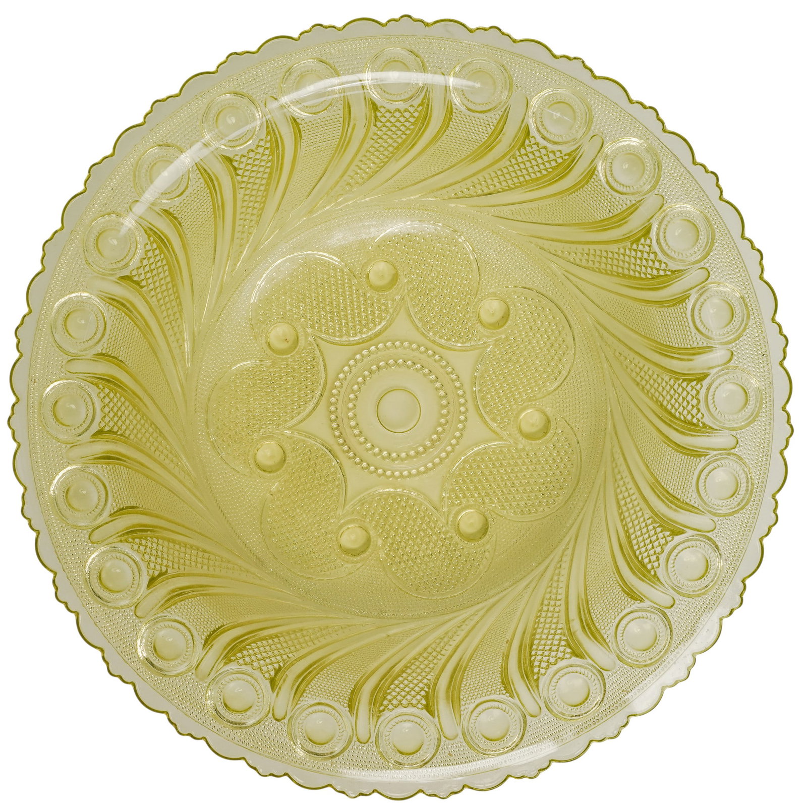 Vintage Halley's Comet Uranium Glass Bowl: Vintage Halley's Comet Uranium Glass Bowl 20th Century, USA Featuring a molded radiating geometric pattern with scalloped rim in luminous yellow-green uranium glass, designed to fluoresce under ultrav