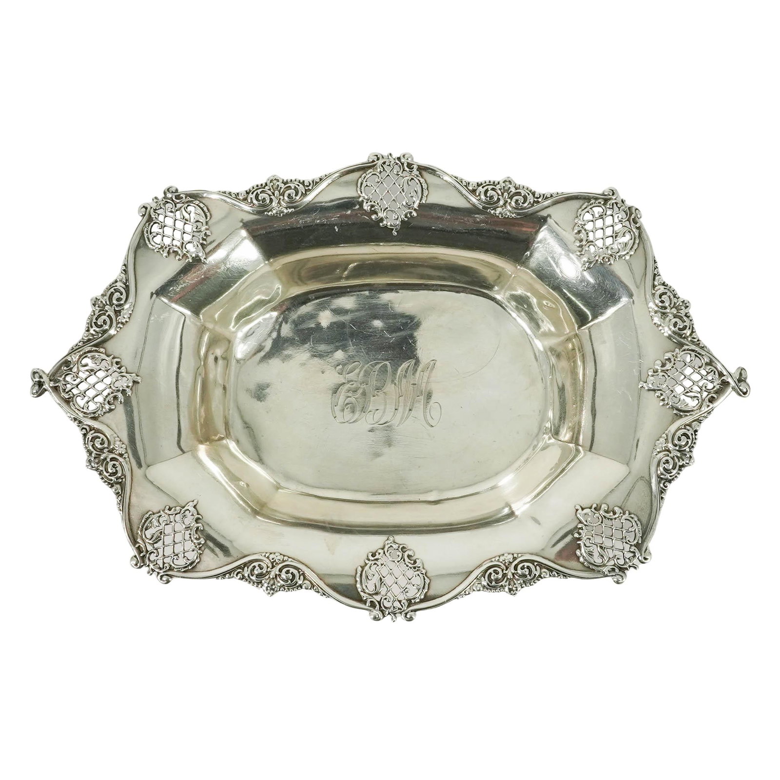 Woodside Sterling Co. Reticulated Silver Dish: Woodside Sterling Co. Reticulated Silver Dish Late 19th-Early 20th c., USA Antique sterling silver oval dish featuring an ornate rim with pierced lattice designs and intricate scrollwork. A fancy scri