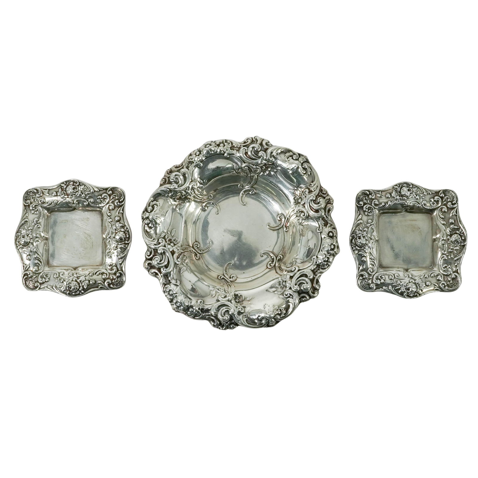 (3 pc) Antique Gorham Sterling Bowl & Butter Pat Trays: (3 pc) Antique Gorham Sterling Bowl & Butter Pat Trays Early 20th Century, USA Gorham sterling silver serving group, comprising of a repoussé bowl and two matching butter pat trays. Each piece featur