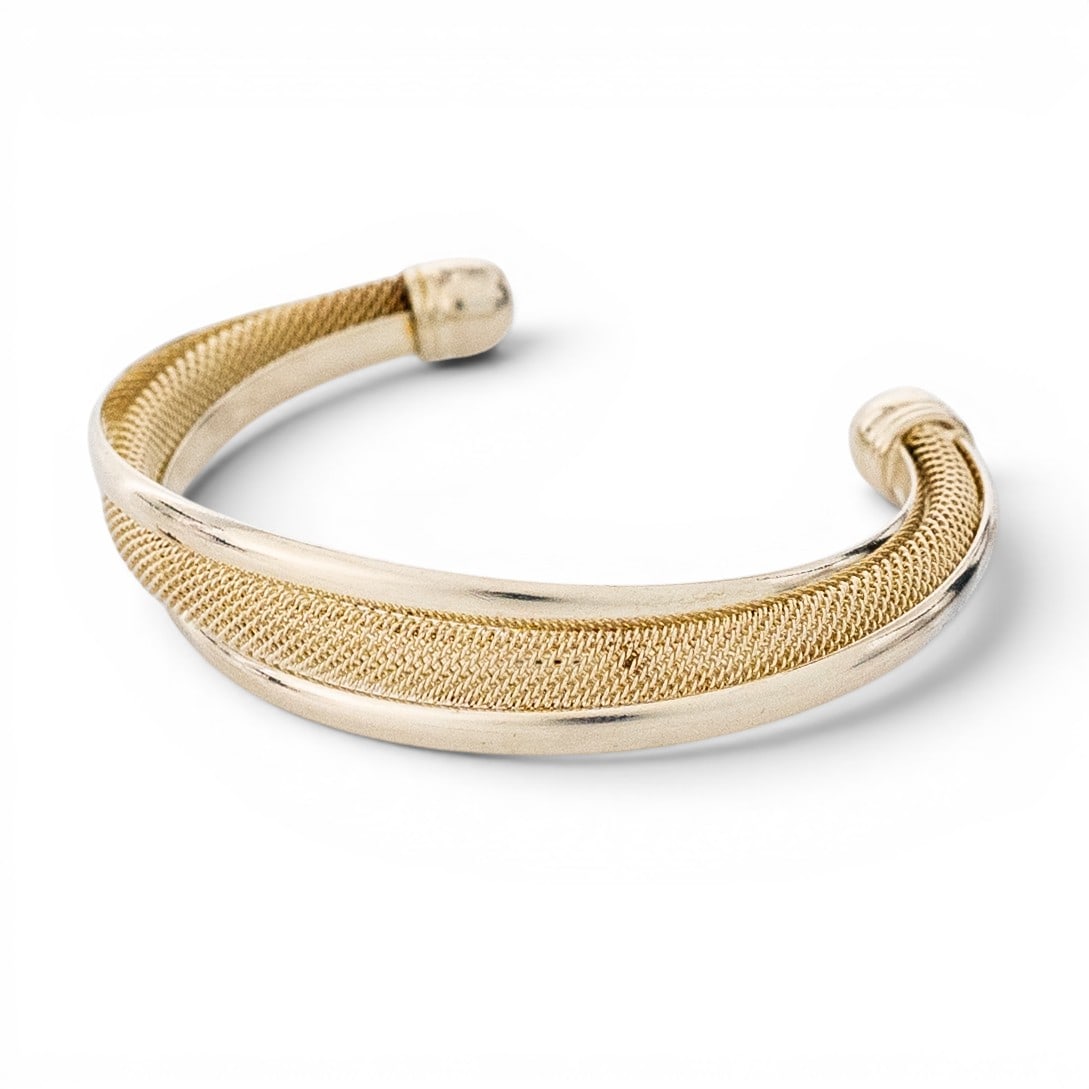 Tiffany & Co. Vermeil Sterling Silver Mesh Cuff Bracelet: Tiffany & Co. Vermeil Sterling Silver Mesh Cuff Bracelet Late 20th century, USA Tiffany & Co. sterling silver open cuff bracelet with polished outer rails, rounded terminal ends, and textured woven me
