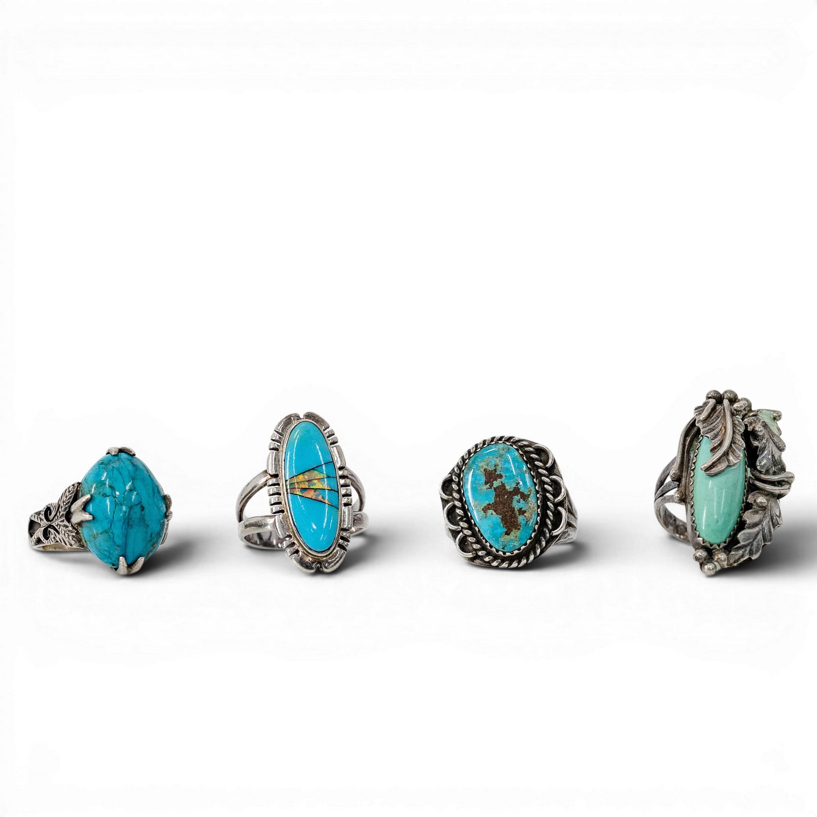(4 Pcs) Navajo Sterling Silver & Turquoise Ring Lot: (4 Pcs) Navajo Sterling Silver & Turquoise Ring Lot 1970s-1980s, USA Navajo silver ring lot comprising four turquoise rings with oval cabochon and inlay settings, including sawtooth bezels, twisted wi