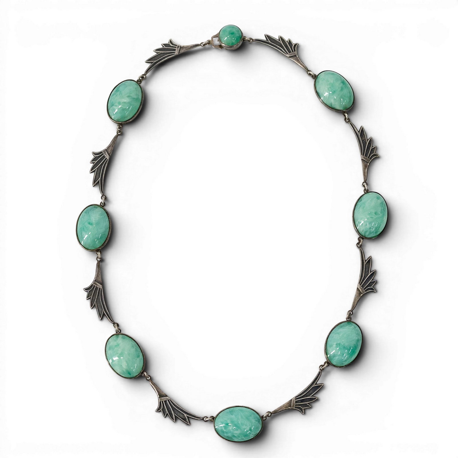 Art Deco Style Sterling Silver & Jade Cabochon Necklace: Art Deco Style Sterling Silver & Jade Cabochon Necklace 20th Cent. This Art Deco style necklace features eight large, matched-set oval jade cabochons showing characteristic variegated "apple green" na