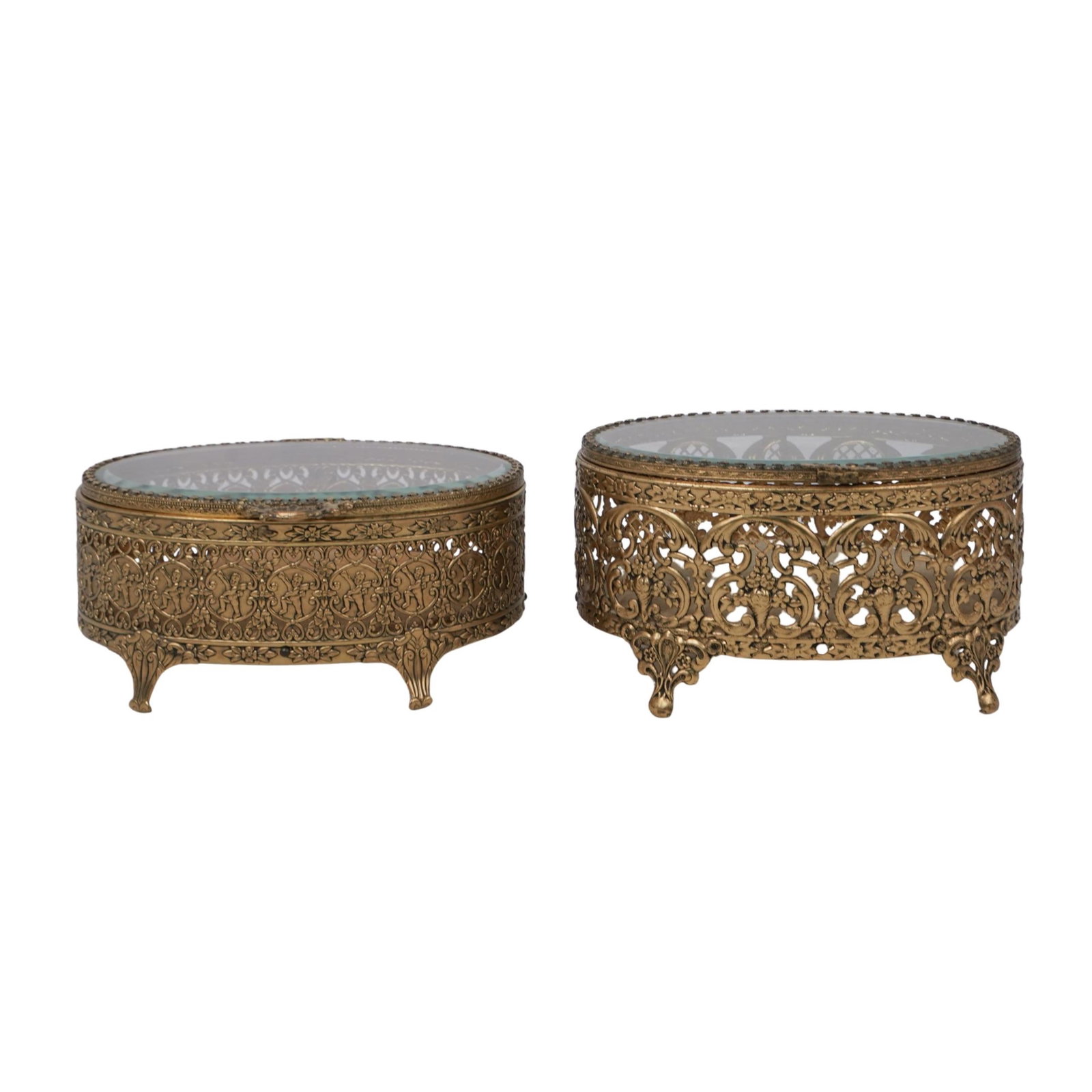 (2 Pc) Antique French Brass Reticulated Casket Jewelry Boxes: (2 Pc) Antique French Brass Reticulated Casket Jewelry Boxes 20th c., Continental Two footed jewelry boxes with openwork brass siding featuring cherub and floral motifs. Both have hinged beveled glass