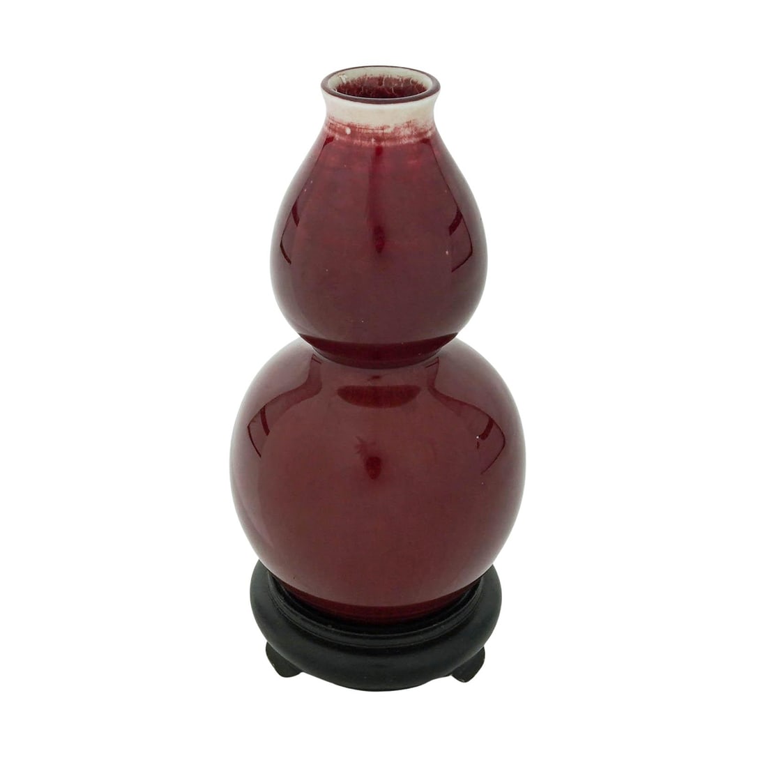 Chinese Qing "Sang De Boeuf" Double Gourd Porcelain Vase: Chinese Qing "Sang De Boeuf" Double Gourd Porcelain Vase Late 19th to early 20th Cent., Chinese This sang de boeuf (oxblood) glazed porcelain vase features a classic double-gourd shape, a form deeply