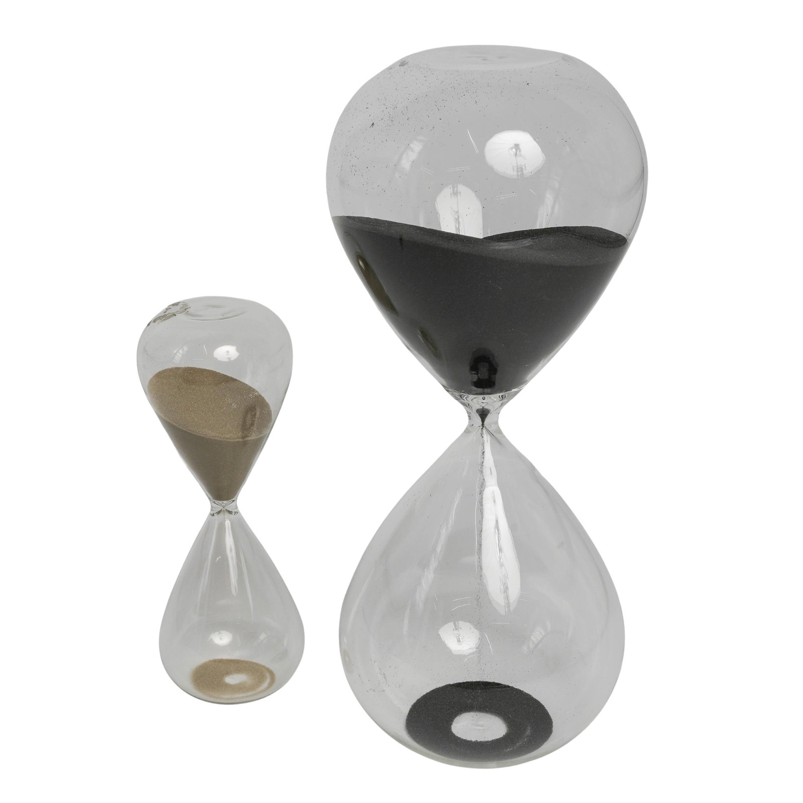 (2 pc) Large Teardrop-Shaped Glass Hourglasses: (2 pc) Large Teardrop-Shaped Glass Hourglasses 20th century, USA Two large hand-blown hourglasses, 60 minutes timer and smaller 15 minutes timer, both teardrop-shaped. Work perfect. 60 min: H. 15" / S