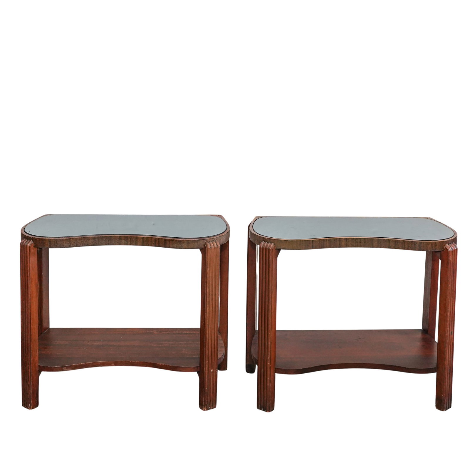 Pair Art Deco Wood & Mirrored Glass Tables: Pair Art Deco Wood & Mirrored Glass Tables Early 20th century, USA A pair of Art Deco side tables featuring distinctive curved mirrored tops. Tables feature wood bases, with reeded leg details. Table 
