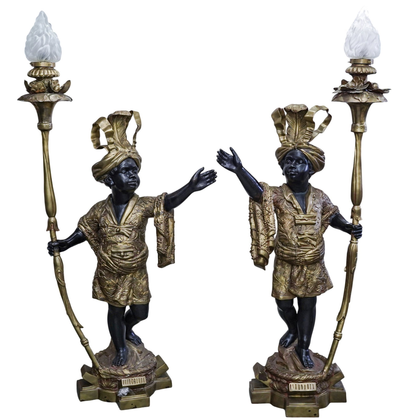 Pair of Life Size Blackamoor Bronze Torchiere Floor Lamps: Pair of Life Size Blackamoor Bronze Torchiere Floor Lamps 20th century A pair of large, life size, Blackamoor cold-painted bronze statues that function as floor lamp torchieres. They depict a figure i