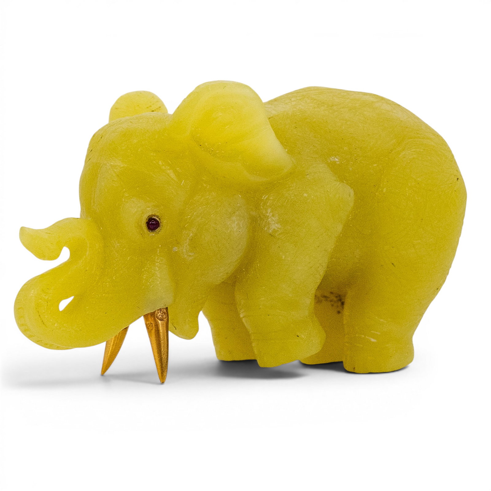 Russian Faberge Style 14k Gold Ruby & Carved Nephrite Elephant: Russian Faberge Style 14k Gold Ruby & Carved Nephrite Elephant Early 20th Century, Russian Carved yellow-green nephrite elephant figure with raised trunk, 14k gold tusks, and ruby cabochon eyes. Tusks