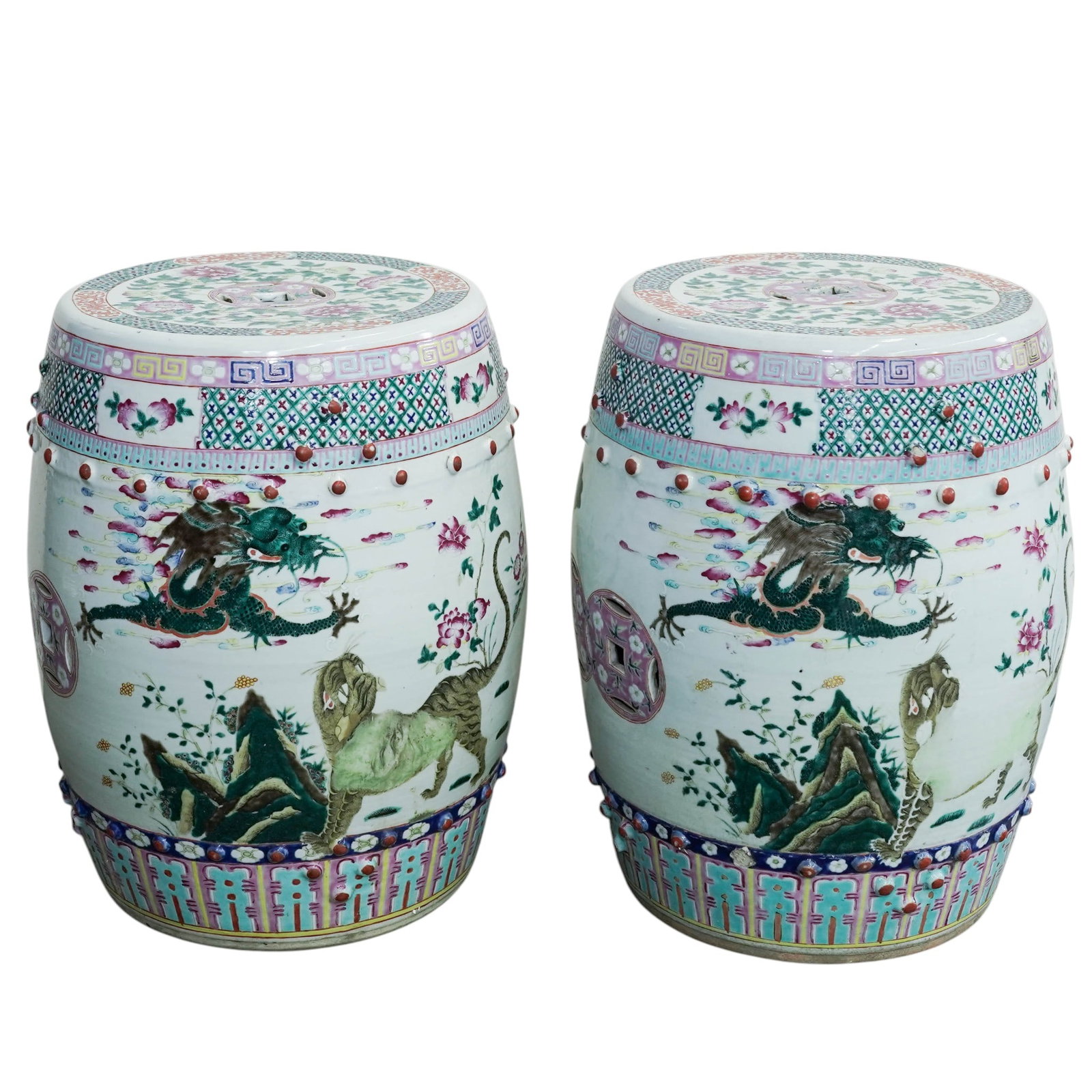 Pair of Chinese Qing Famille Rose Export Porcelain Garden Stools: Pair of Chinese Qing Famille Rose Export Porcelain Garden Stools Late 19th- early 20th century, Chinese A pair of late Qing dynasty famille rose porcelain garden stools. Each feature traditional famil