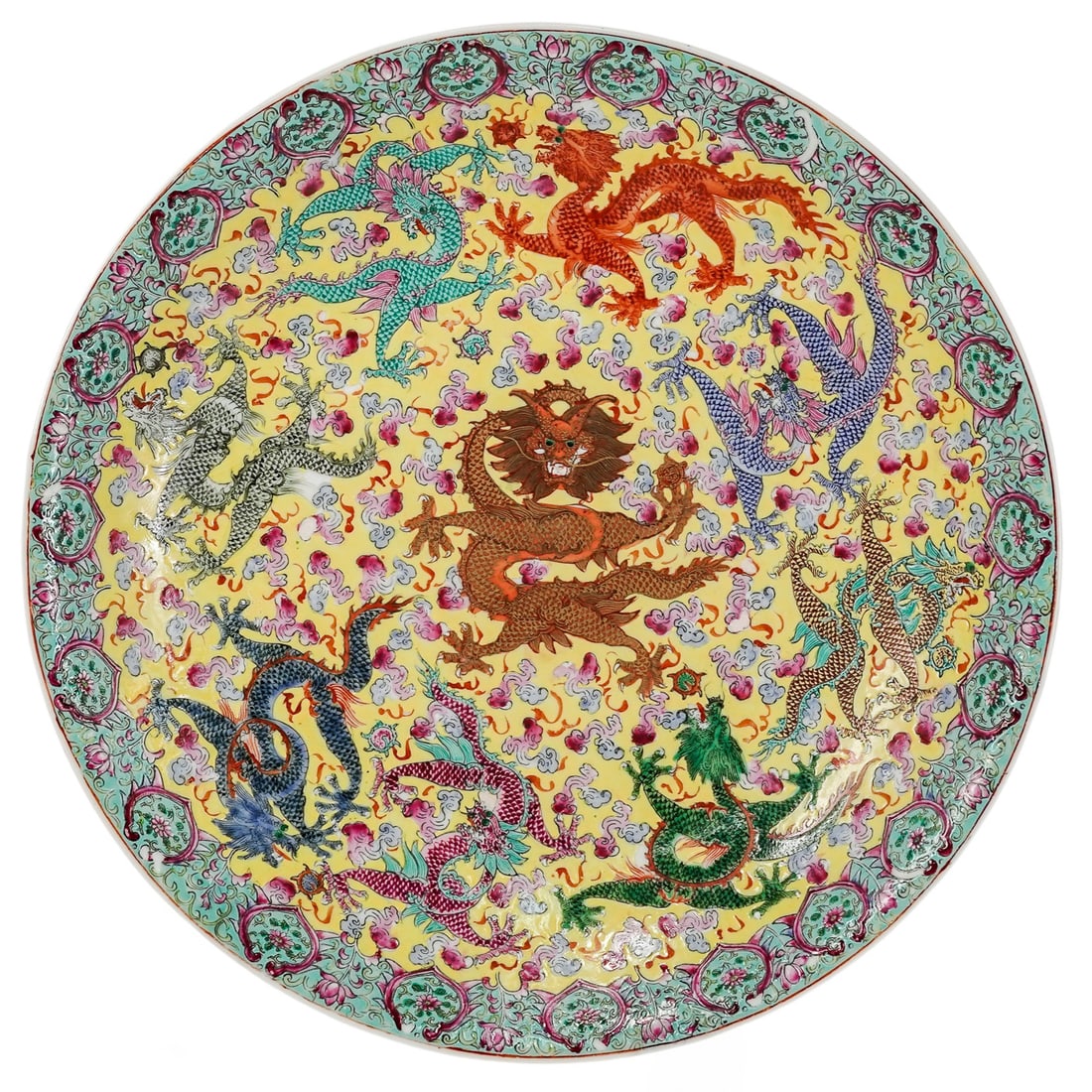 Chinese Famille Jaune Dragon Porcelain Charger: Chinese Famille Jaune Dragon Porcelain Charger 20th Cent., Chinese This Chinese porcelain charger is a masterful example of Famille Jaune artistry, featuring a vibrant imperial yellow ground that trad