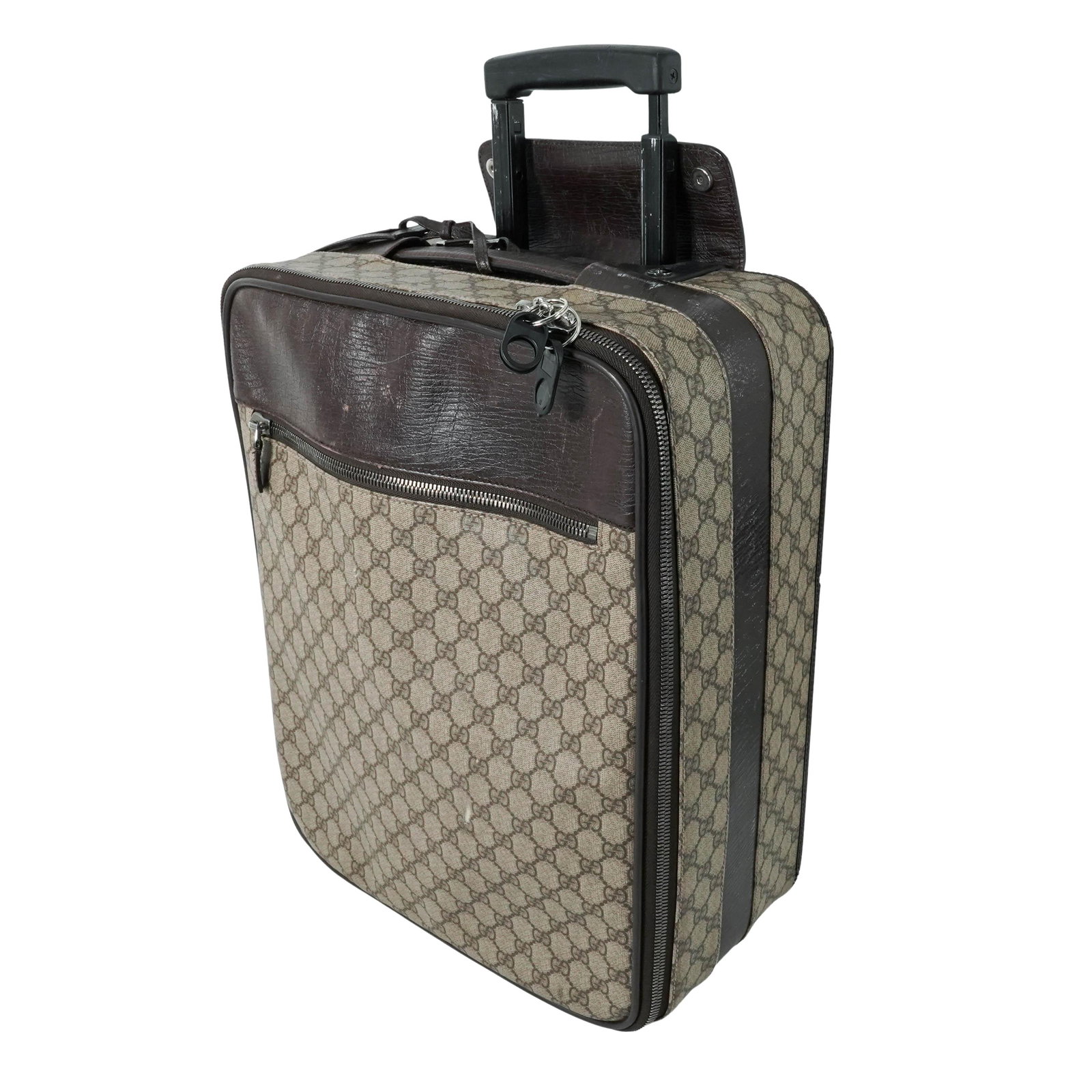 Vintage Gucci Rolling Suitcase: Vintage Gucci Rolling Suitcase 20th cent. Italy Travel case by Gucci, crafted in the house’s signature GG monogram coated canvas with brown leather trim and silver-tone hardware. Rectangular form wi