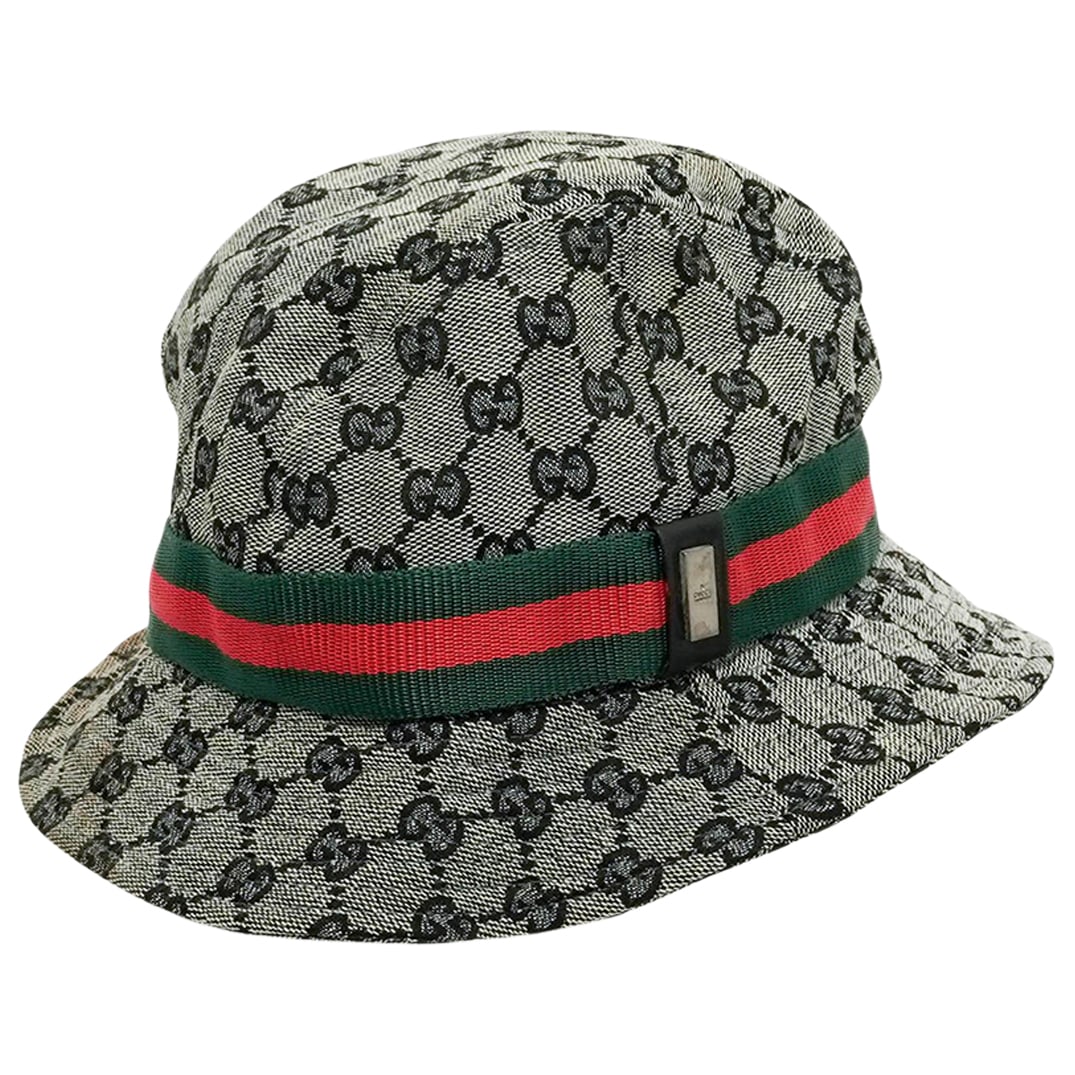 Gucci Monogram Web Bucket Hat: Gucci Monogram Web Bucket Hat Late 20th Century, Italy Gucci GG Monogram Canvas Bucket Hat, featuring the signature interlocking GG pattern with green and red web stripe accent and front metal detail.