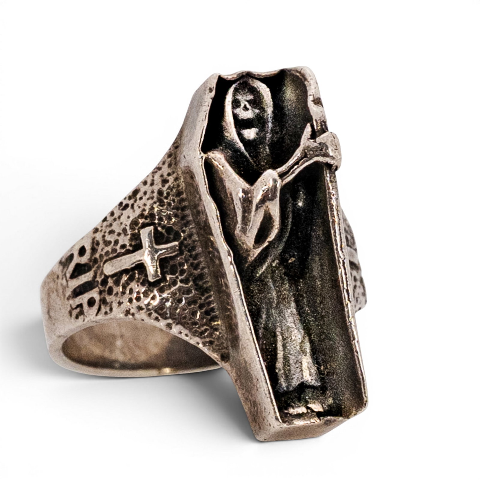 Sterling Silver Coffin Grim Reaper Ring: Sterling Silver Coffin Grim Reaper Ring Early 21st Century Sterling silver figural ring featuring a coffin-form top with grim reaper/skeleton figure inside. Band has textured shoulders with cross and 