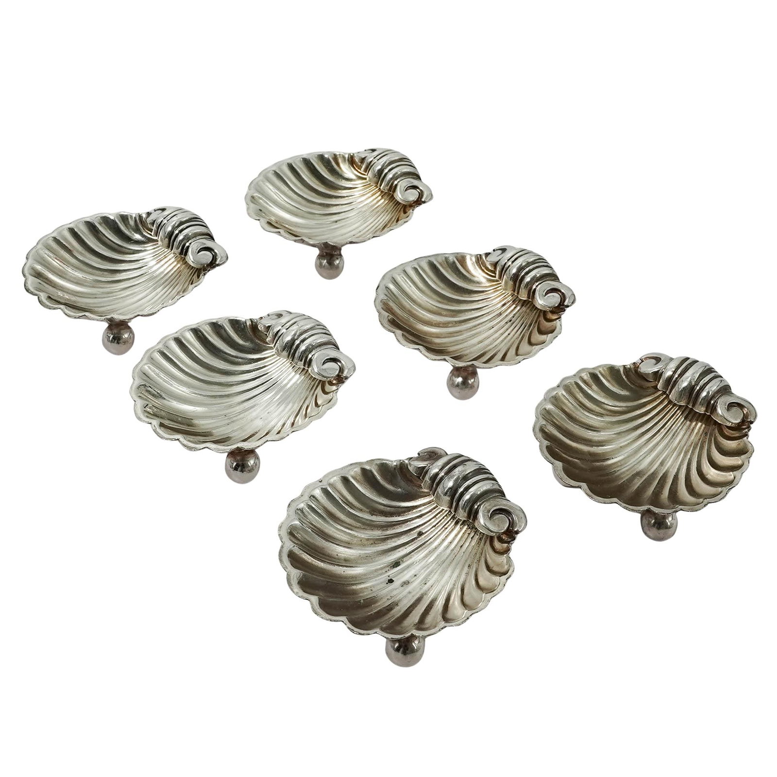 (6pc) Victorian English Silver Plated Shell Salt Cellars: (6pc) Victorian English Silver Plated Shell Salt Cellars Early 20th Cent., English This is a set of six English silver plated salt cellars, designed in the classic scallop shell motif. Each cellar is 