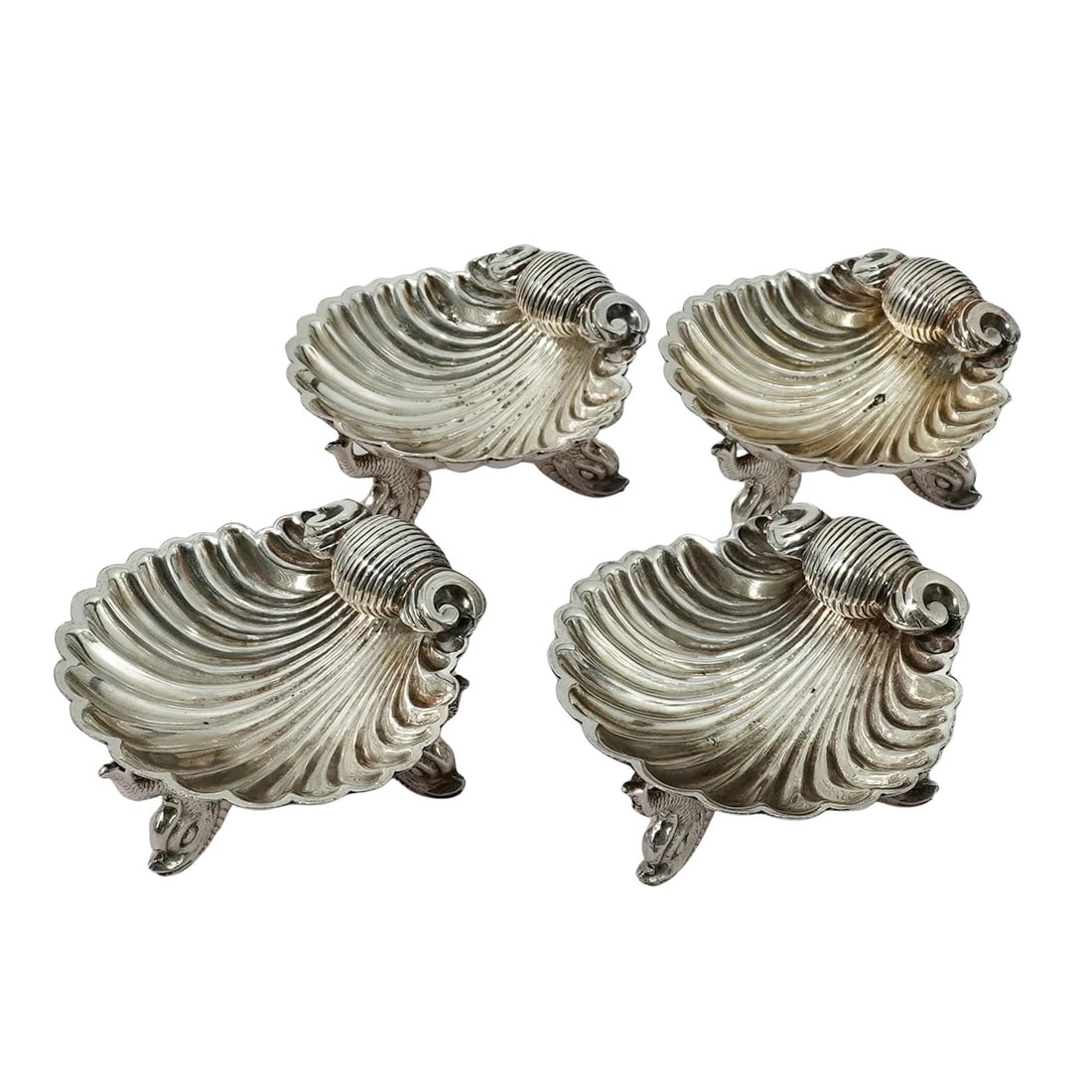 (4pc) Victorian Silver Plated Shell-Shaped Salt Dishes: (4pc) Victorian Silver Plated Shell-Shaped Salt Dishes Early 20th Cent. Vintage shell-shaped silver palted footed dishes. Each is modeled after a fluted scallop shell, a classic motif in European silv