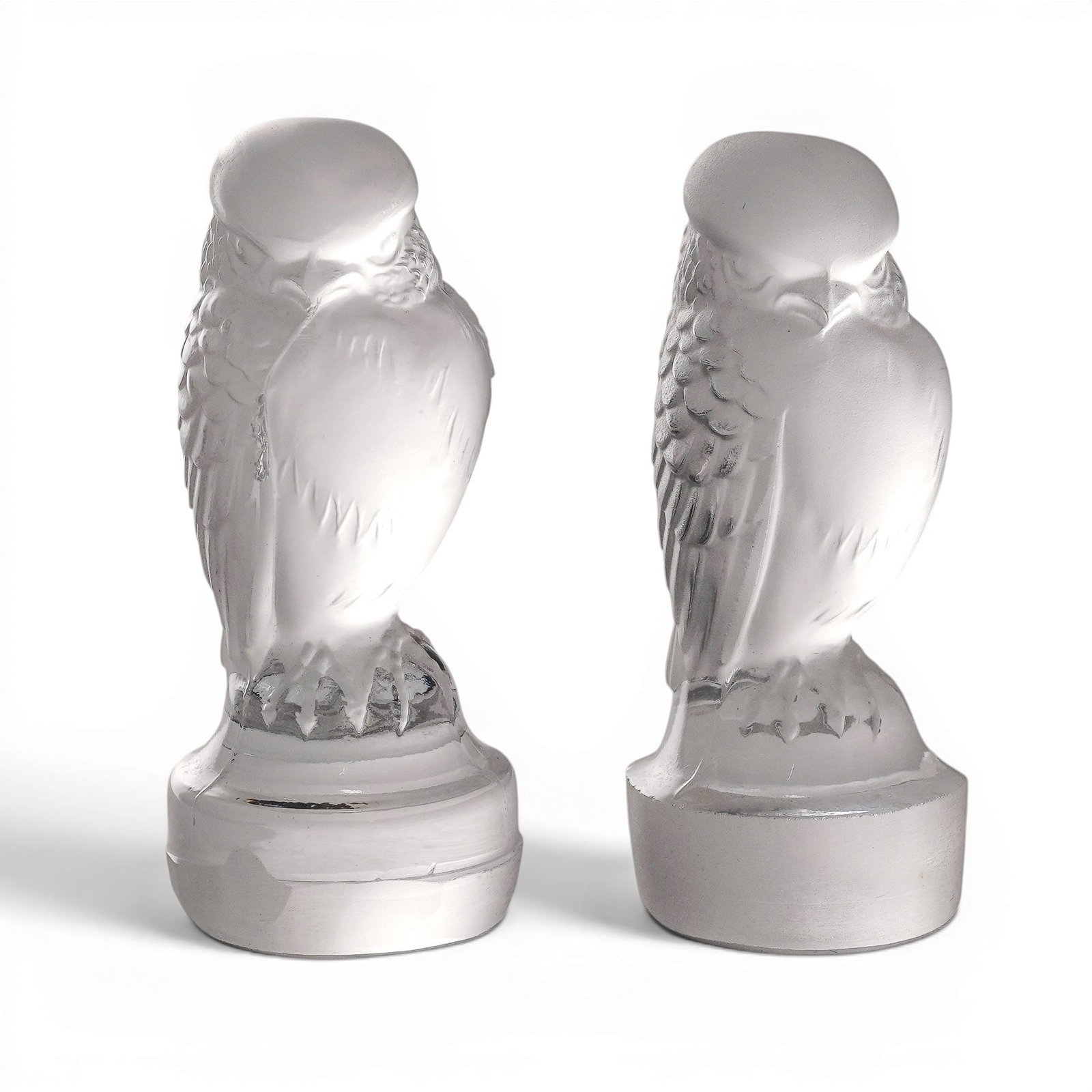 Pair of Lalique Crystal Frosted Paperweights: Pair of Lalique Crystal Frosted Paperweights 20th Century, France. This exquisite Lalique France frosted crystal Hawk figurine captures the delicate beauty of the bird in a poised stance. Expertly cra