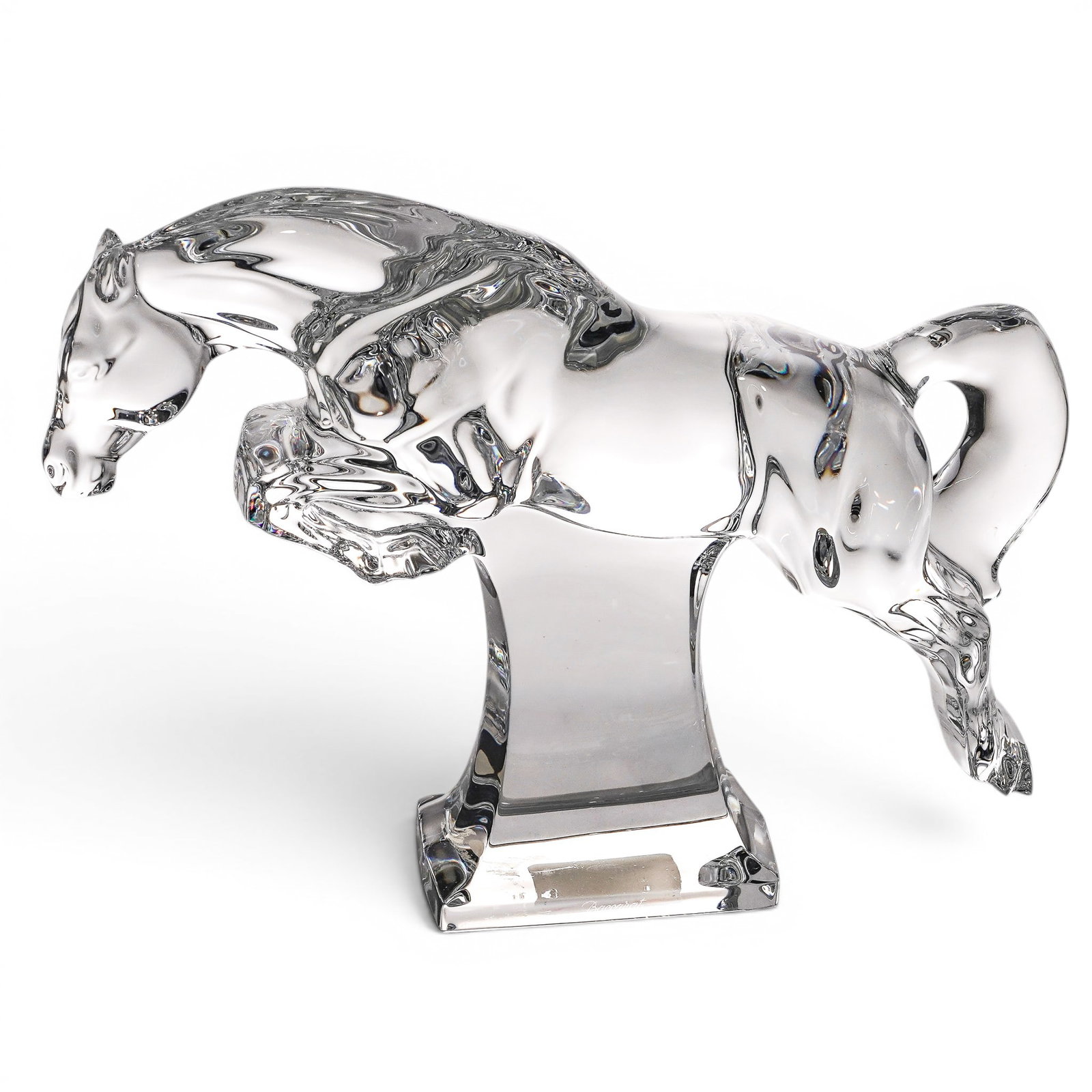 Baccarat Jumping Cheval Crystal Horse Figurine: Baccarat Jumping Cheval Crystal Horse Figurine 20th century, France The horse is captured in a mid-jump pose, with its front legs tucked and rear legs extended. It is supported by an integral clear re