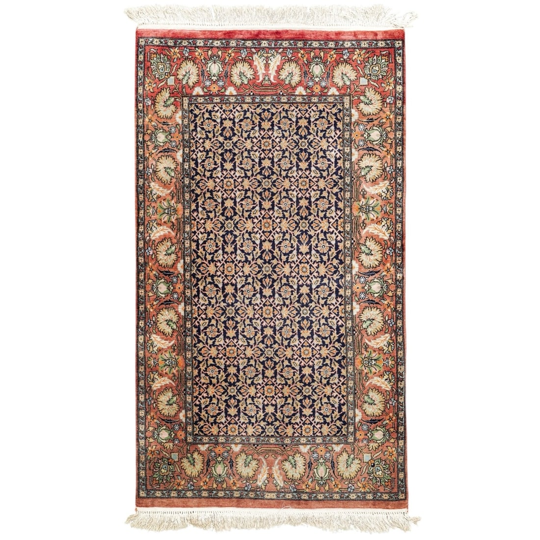 Pakistani Lahore Herati Wool Rug: Pakistani Lahore Herati Wool Rug 20th century, Pakistani A Pakistani lahore herati hand-knotted wool rug featuring all-over floral lattice on a navy field. Set against a pale reddish orange border wit