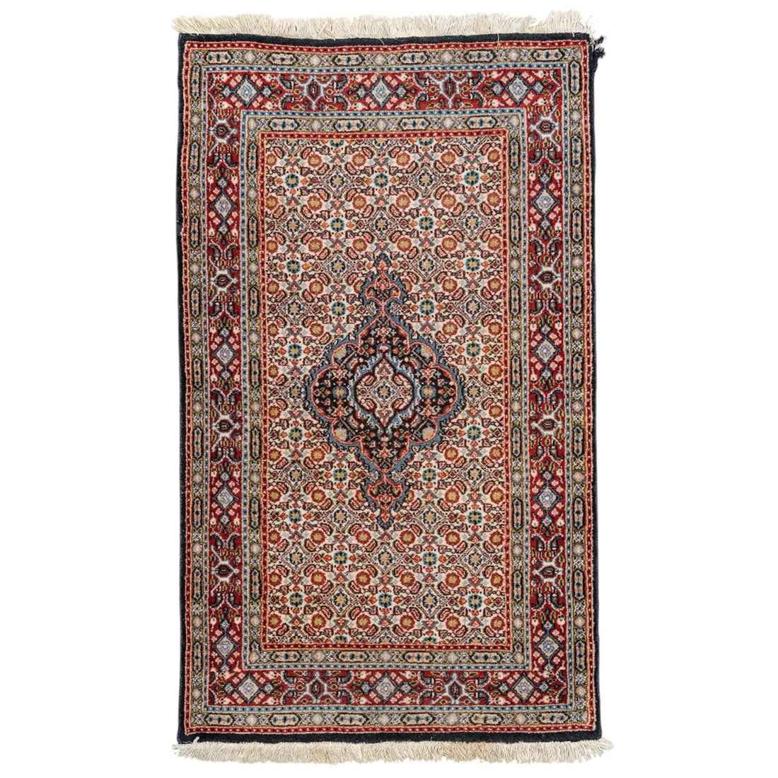 Persian Moud Wool Rug: Persian Moud Wool Rug 20th century, Iran A Persian Moud wool rug. Features the classic Herati pattern (also known as the Mahi or "fish" pattern), and a prominent central medallion. White tassel finish