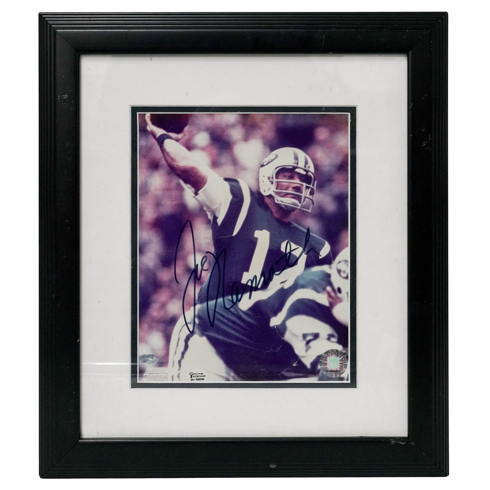 Joe Namath (American, 1943-) Autographed Photo: Joe Namath (American, 1943- ) Autographed Photo 2001, USA. Color photograph depicting Joe Namath in New York Jets uniform, signed in marker, "Joe Namath," across the image. Presented in a black frame 